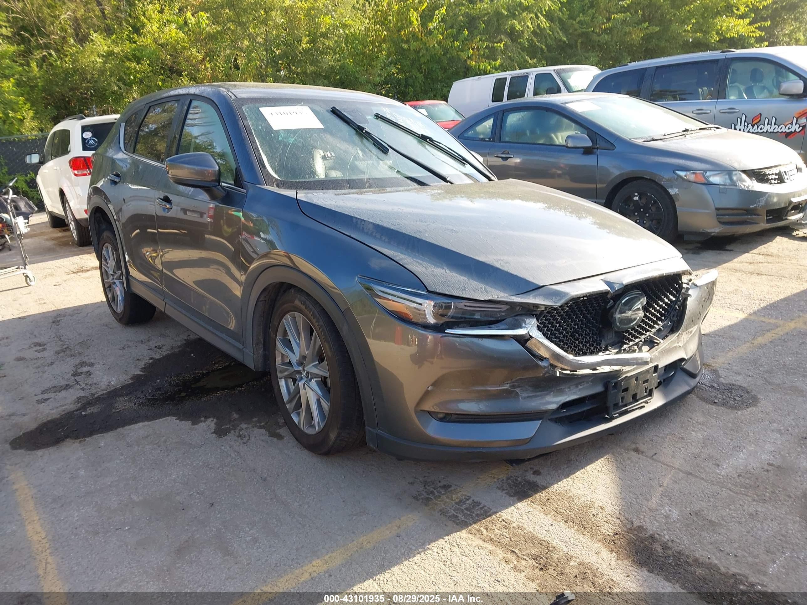 2021 Mazda CX-5 Grand Touring, VIN JM3KFBDM4M0364709 — Side