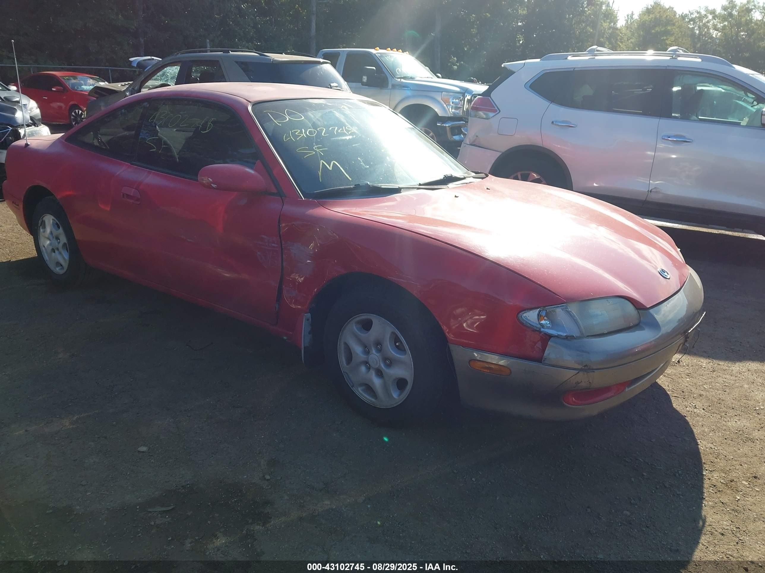 1993 Mazda MX-6, VIN 1YVGE31A7P5232546 — Side