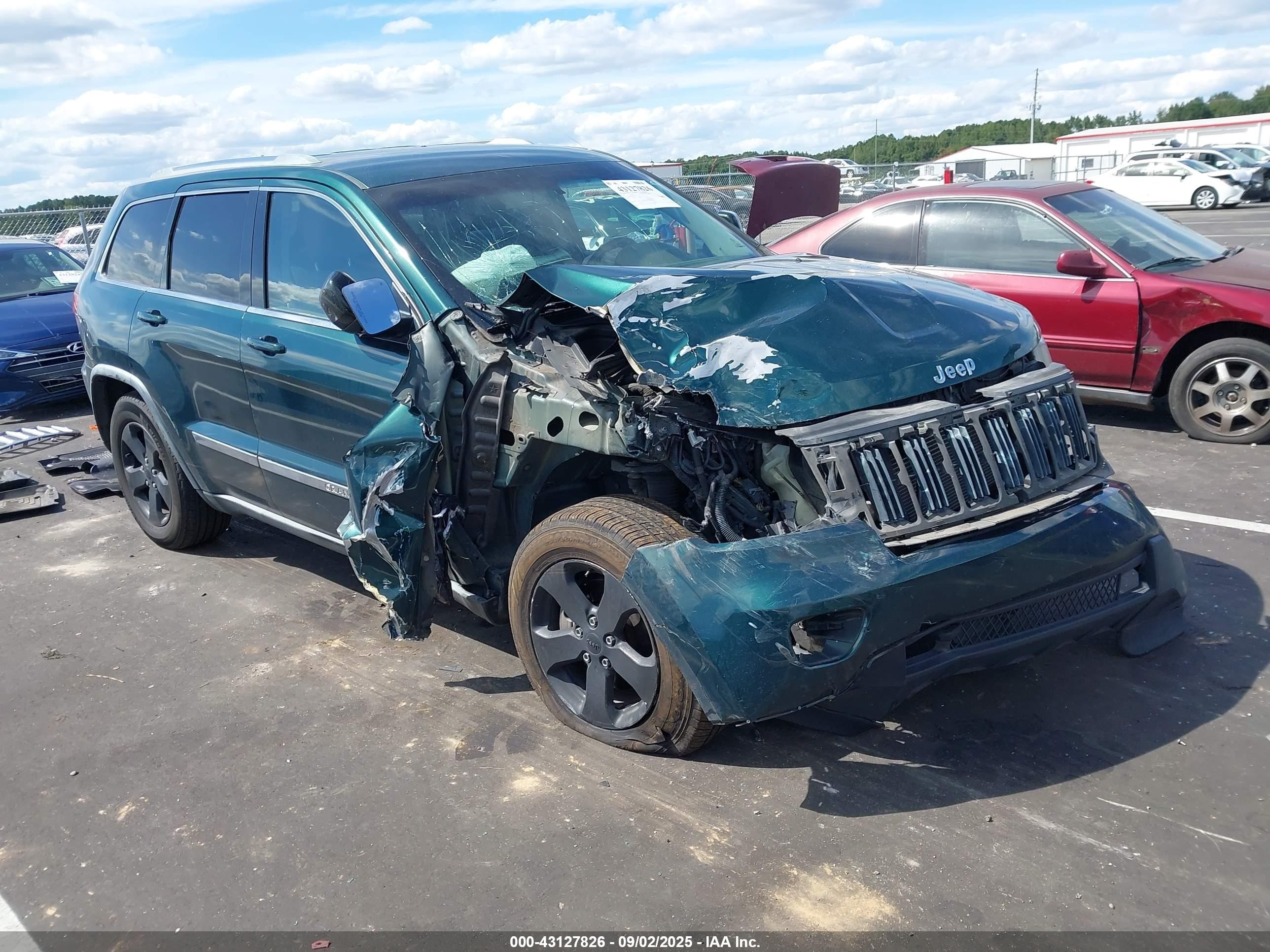 2011 Jeep Grand Cherokee Laredo, VIN 1J4RR4GGXBC542189 — Front end