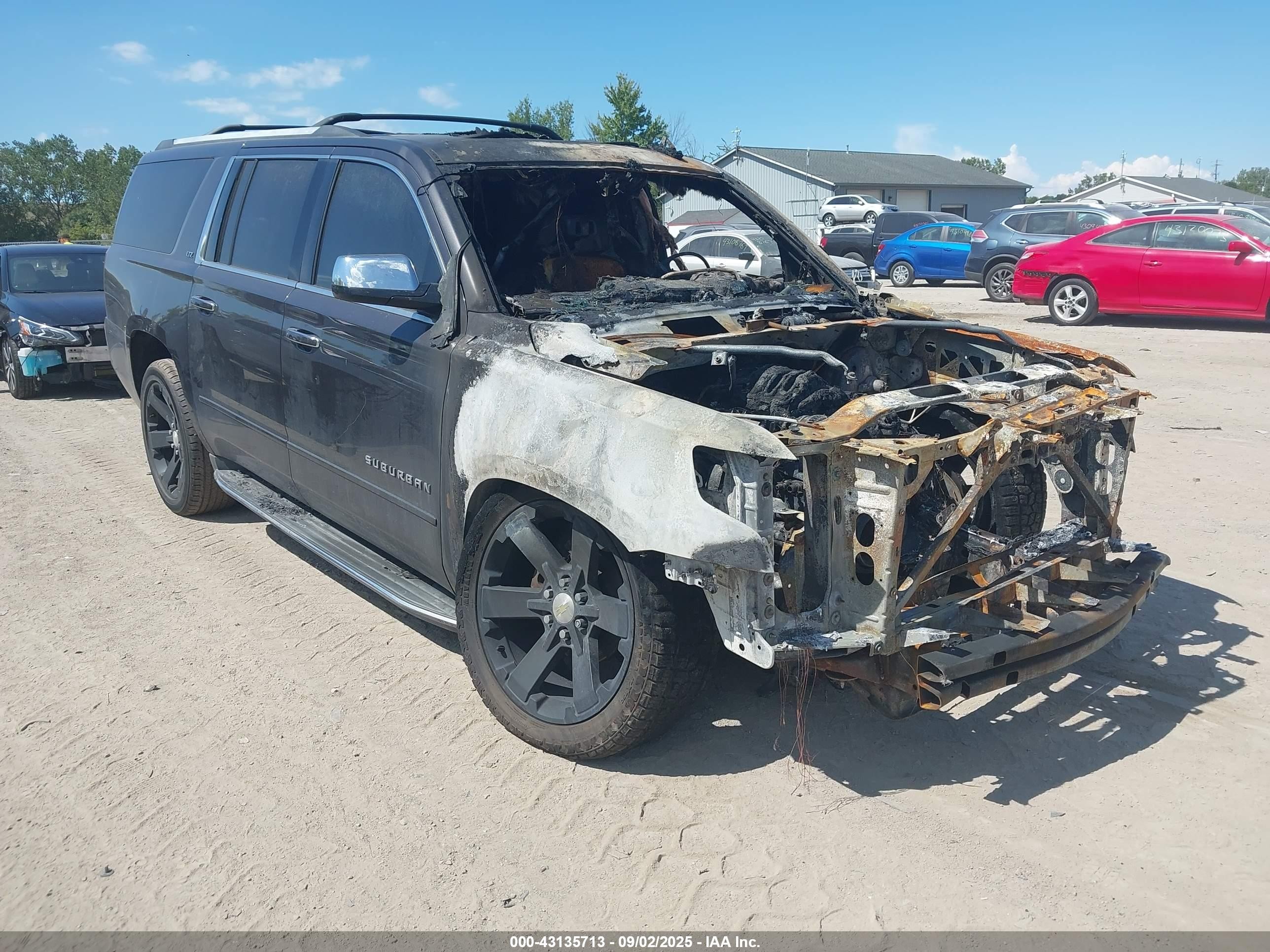 2015 Chevrolet Suburban LTZ, VIN 1GNSKKKC5FR683735 — Engine fire