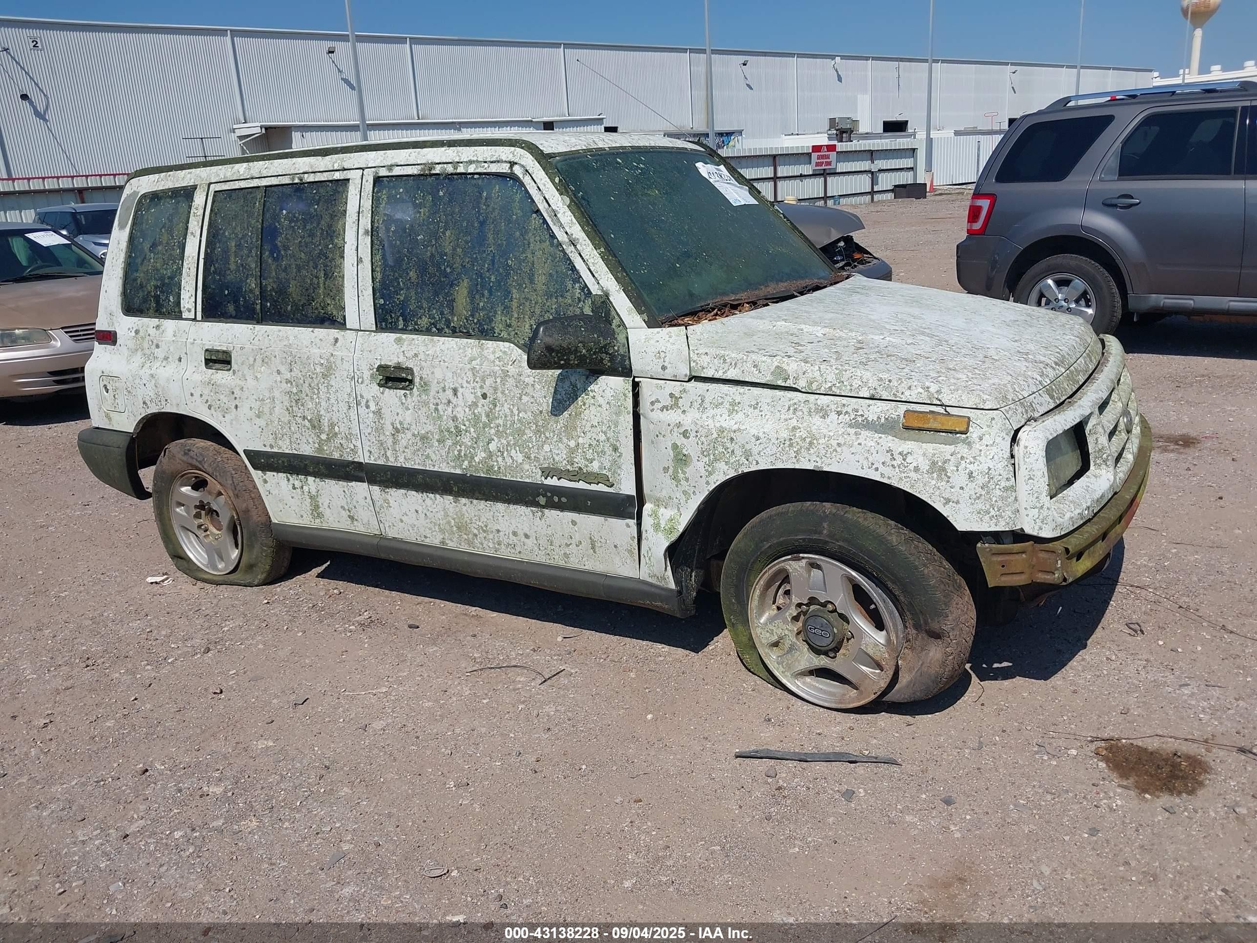 1996 Geo Tracker, VIN 2CNBE1369T6943219 — Water / flood