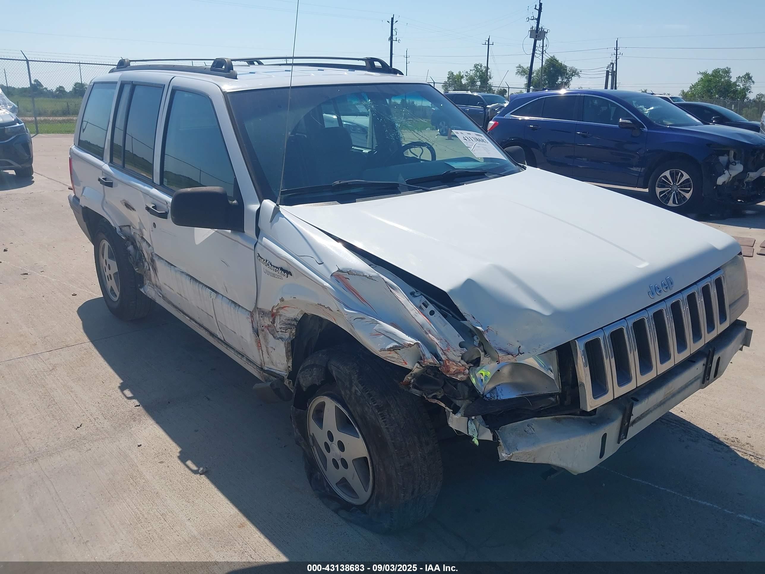 1994 Jeep Grand Cherokee Laredo, VIN 1J4GZ58S6RC123878 — Side