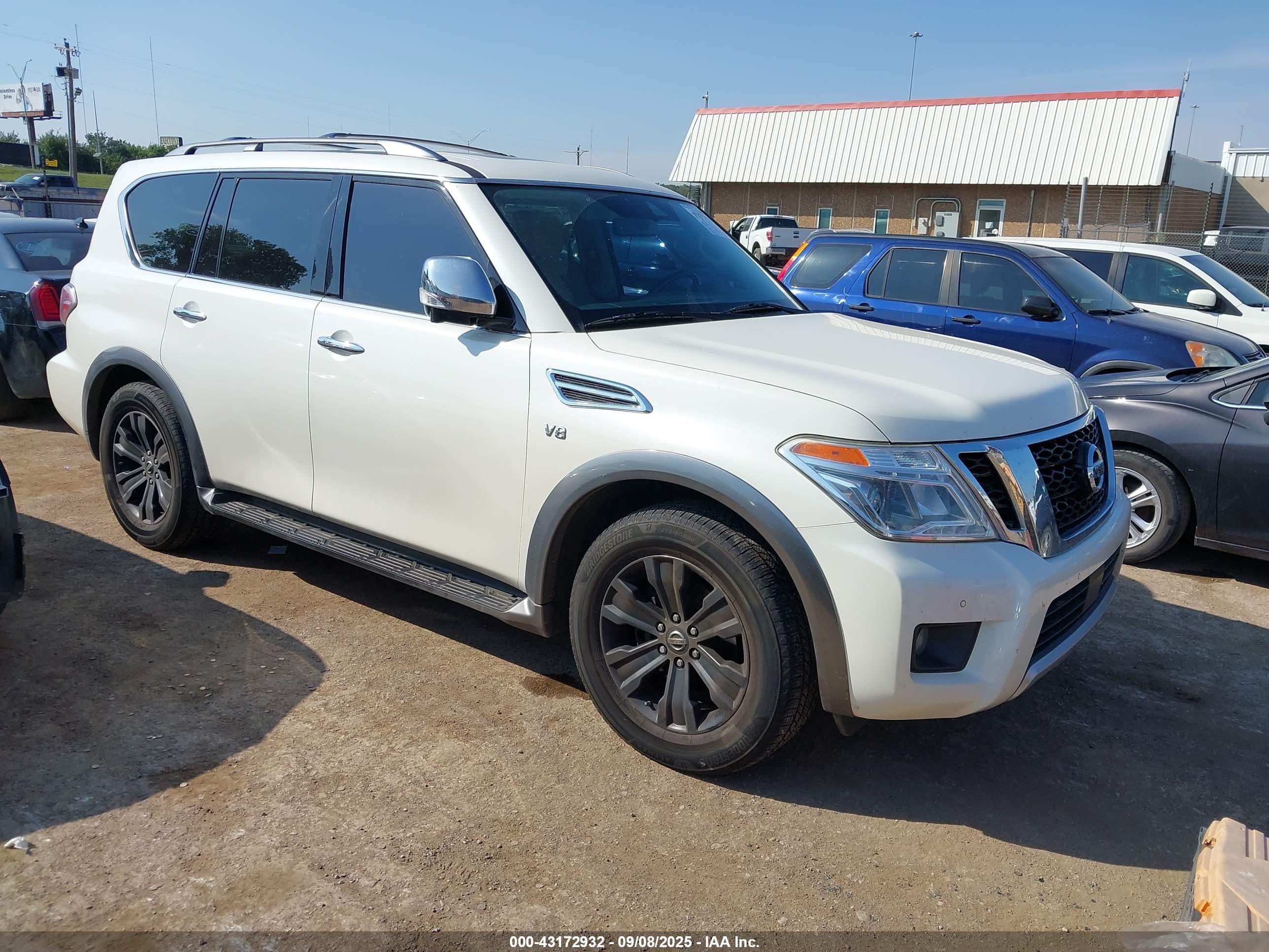 2018 Nissan Armada Platinum, VIN JN8AY2NE2J9735304 — Side