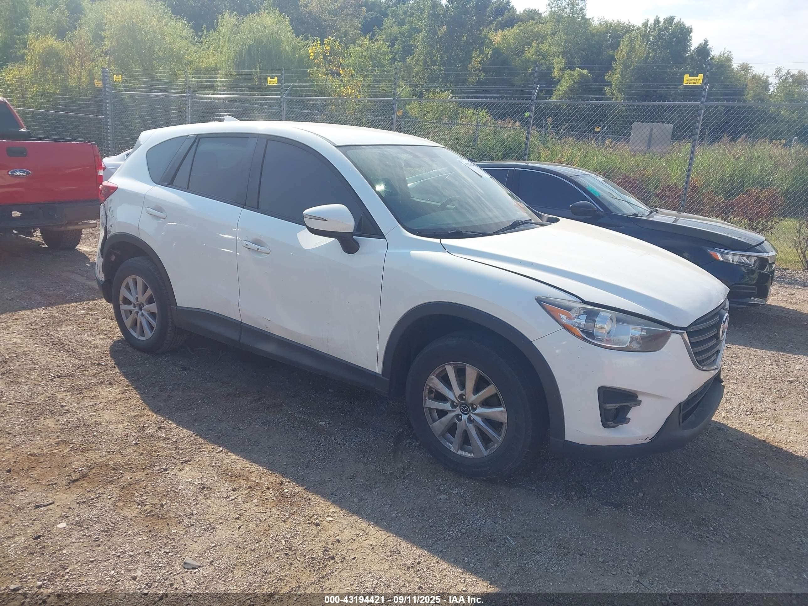 2016 Mazda CX-5 Touring, VIN JM3KE4CY0G0913250 — Rear end