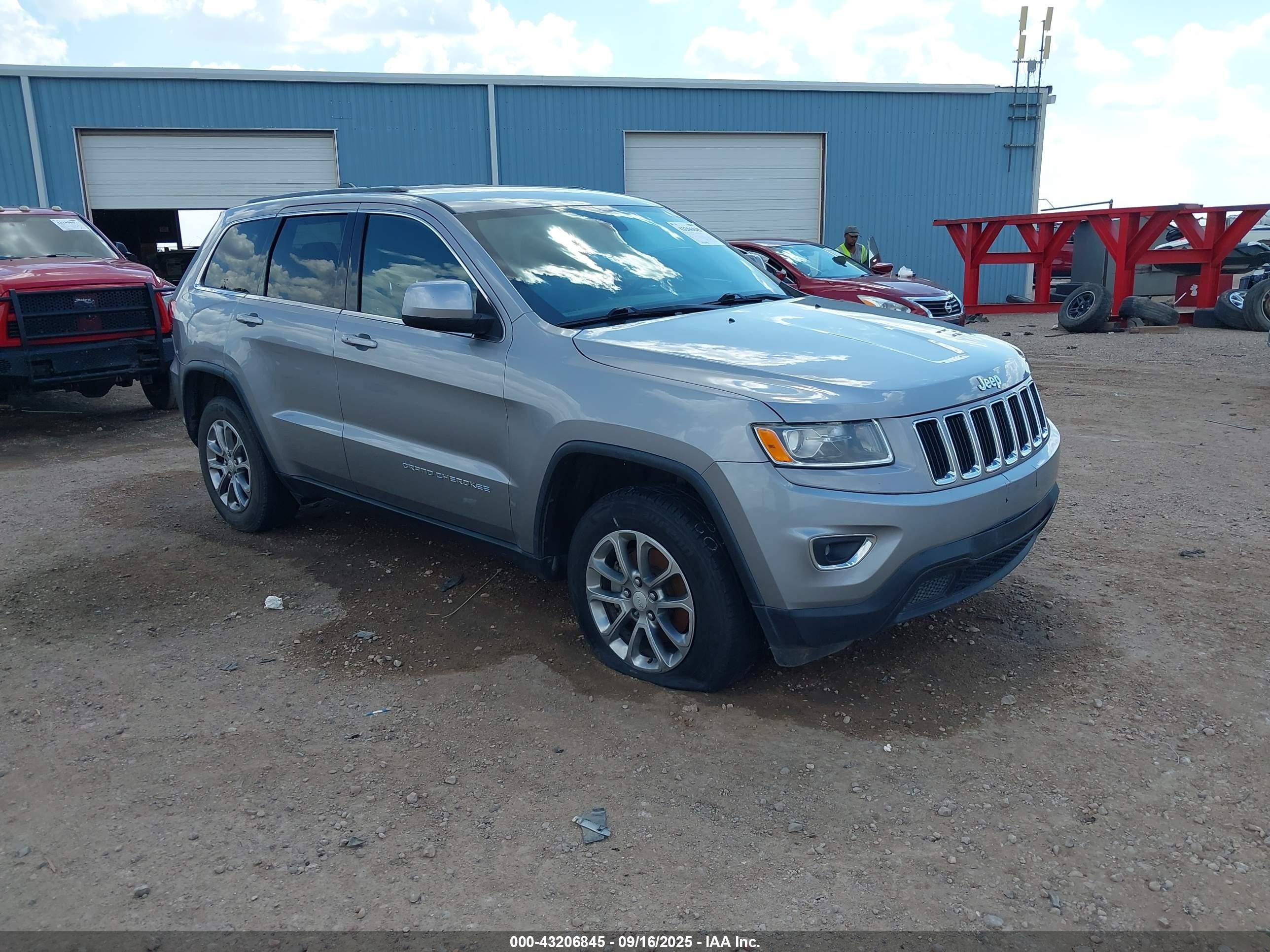 2015 Jeep Grand Cherokee Laredo, VIN 1C4RJFAG6FC893883 — Storm