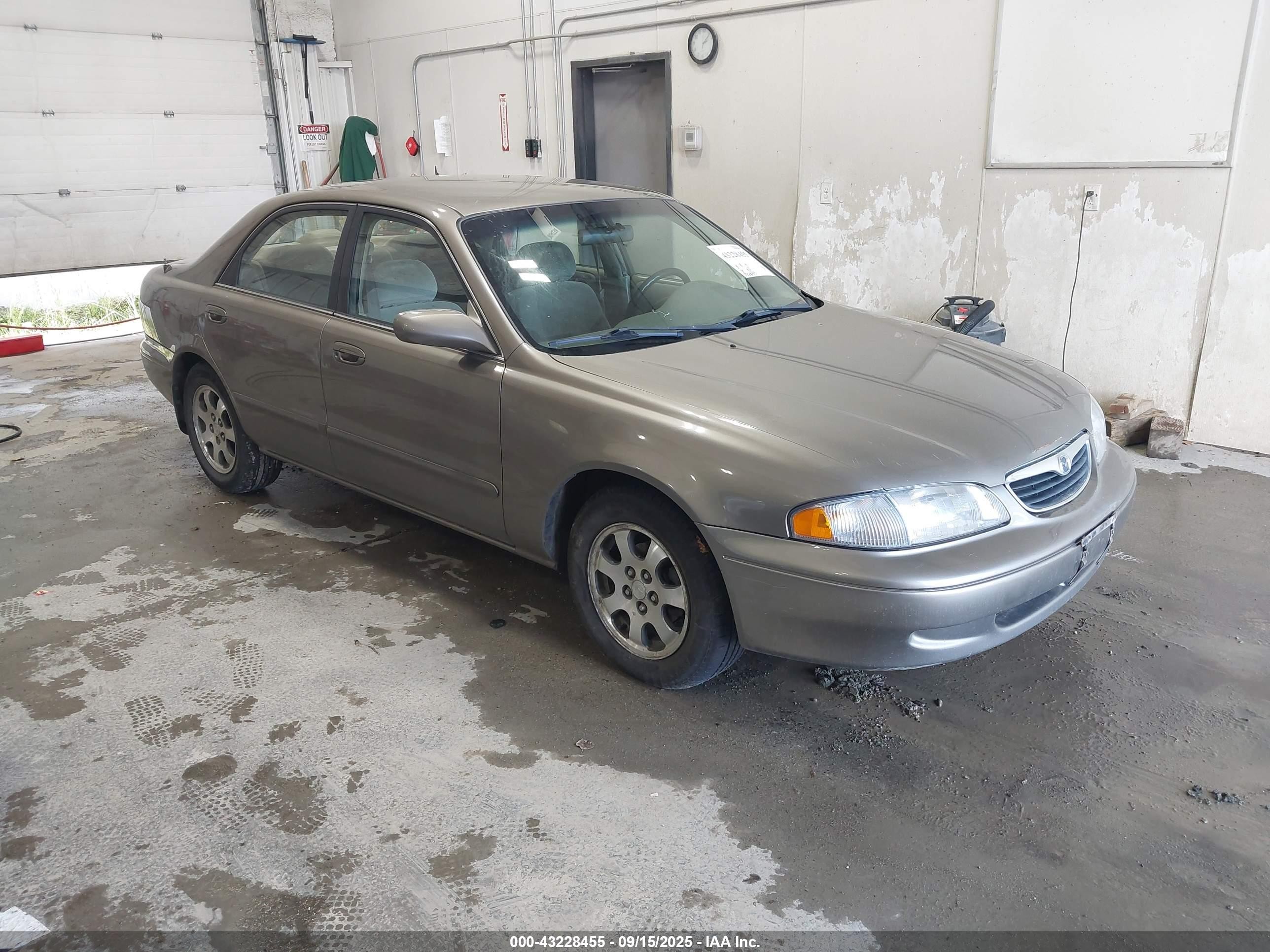 1999 Mazda 626 ES, VIN 1YVGF22C6X5893816 — Front end