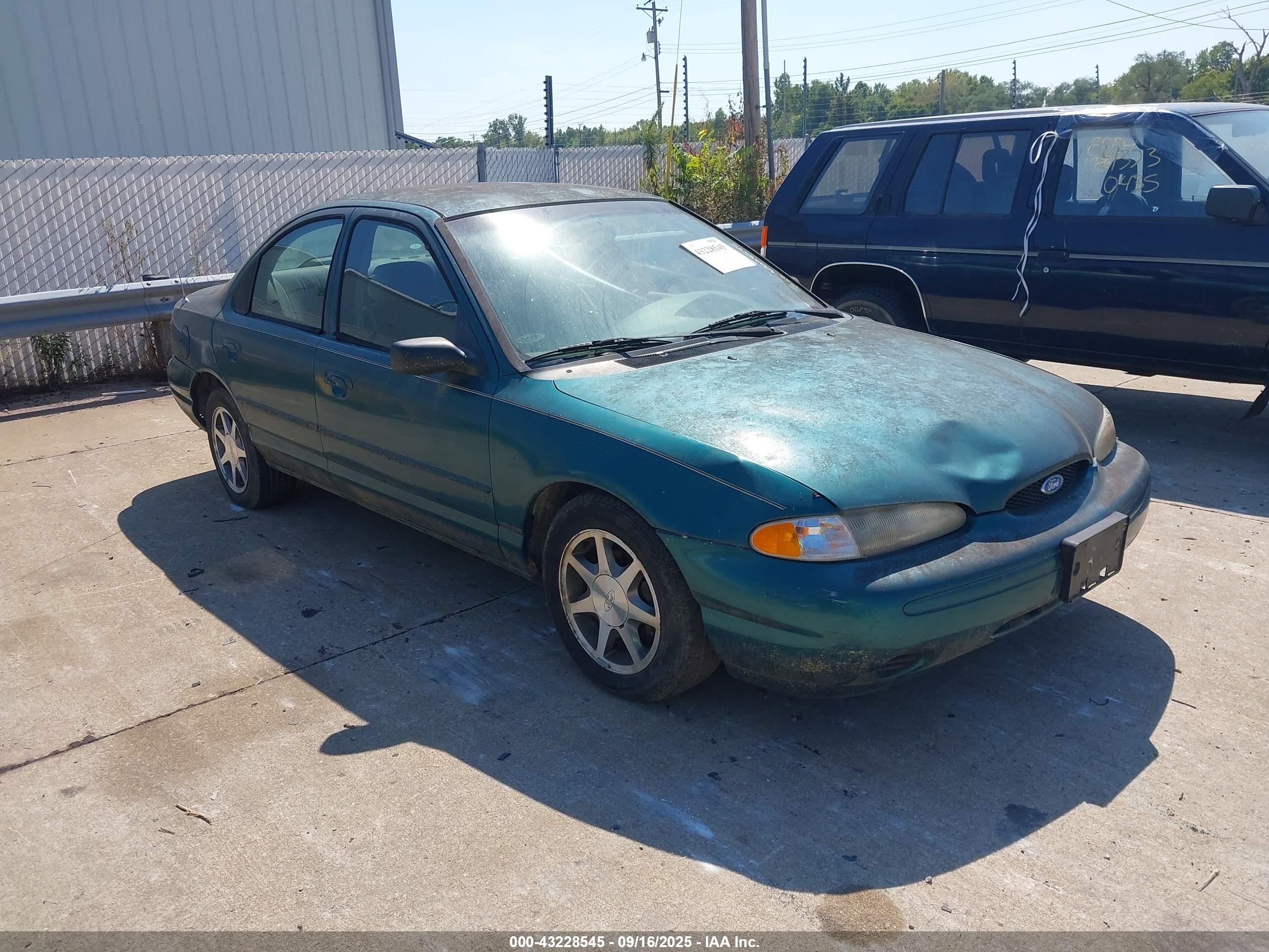 1997 Ford Contour GL, VIN 1FALP6535VK137371 — Normal wear