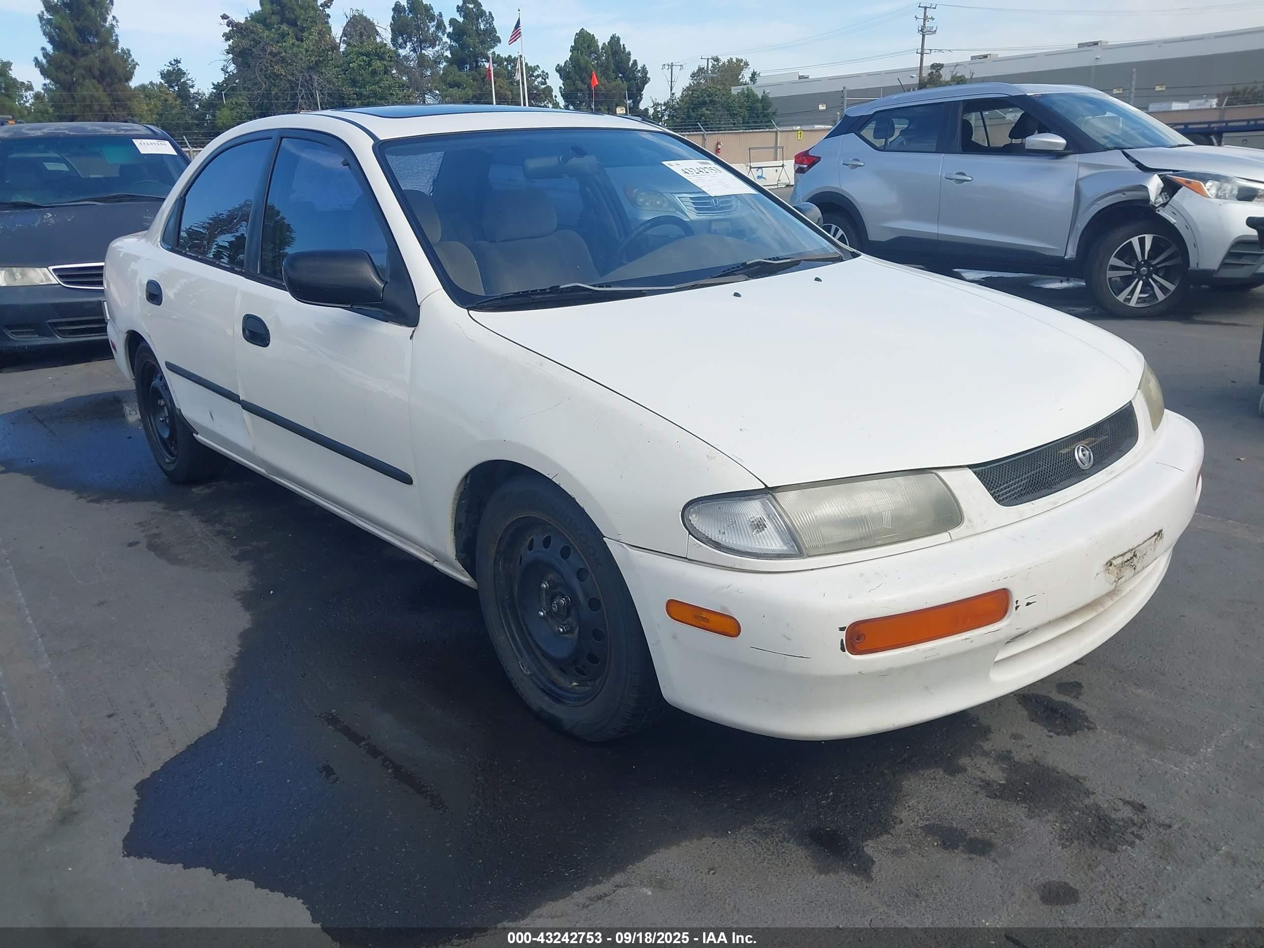 1995 Mazda Protege, VIN JM1BA1416S0110519 — По всему кузову