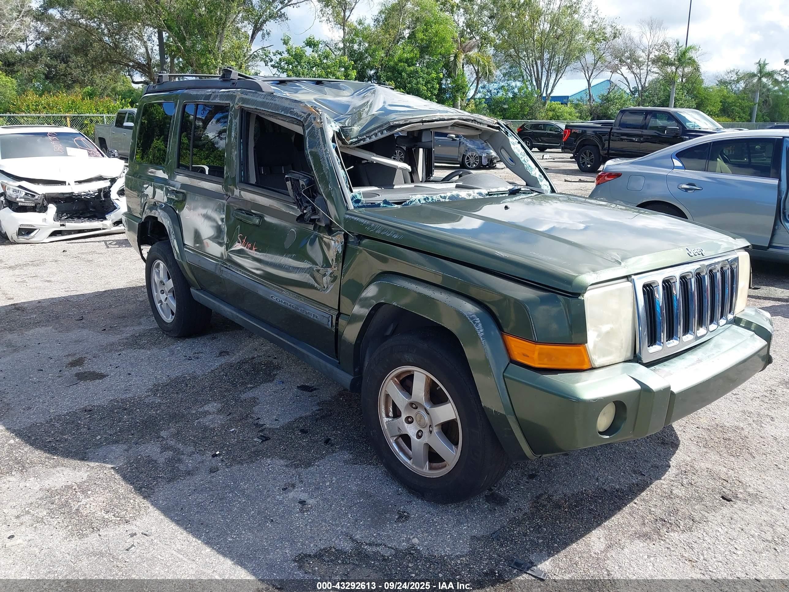 2009 Jeep Commander Sport, VIN 1J8HG48K39C509838 — Rollover