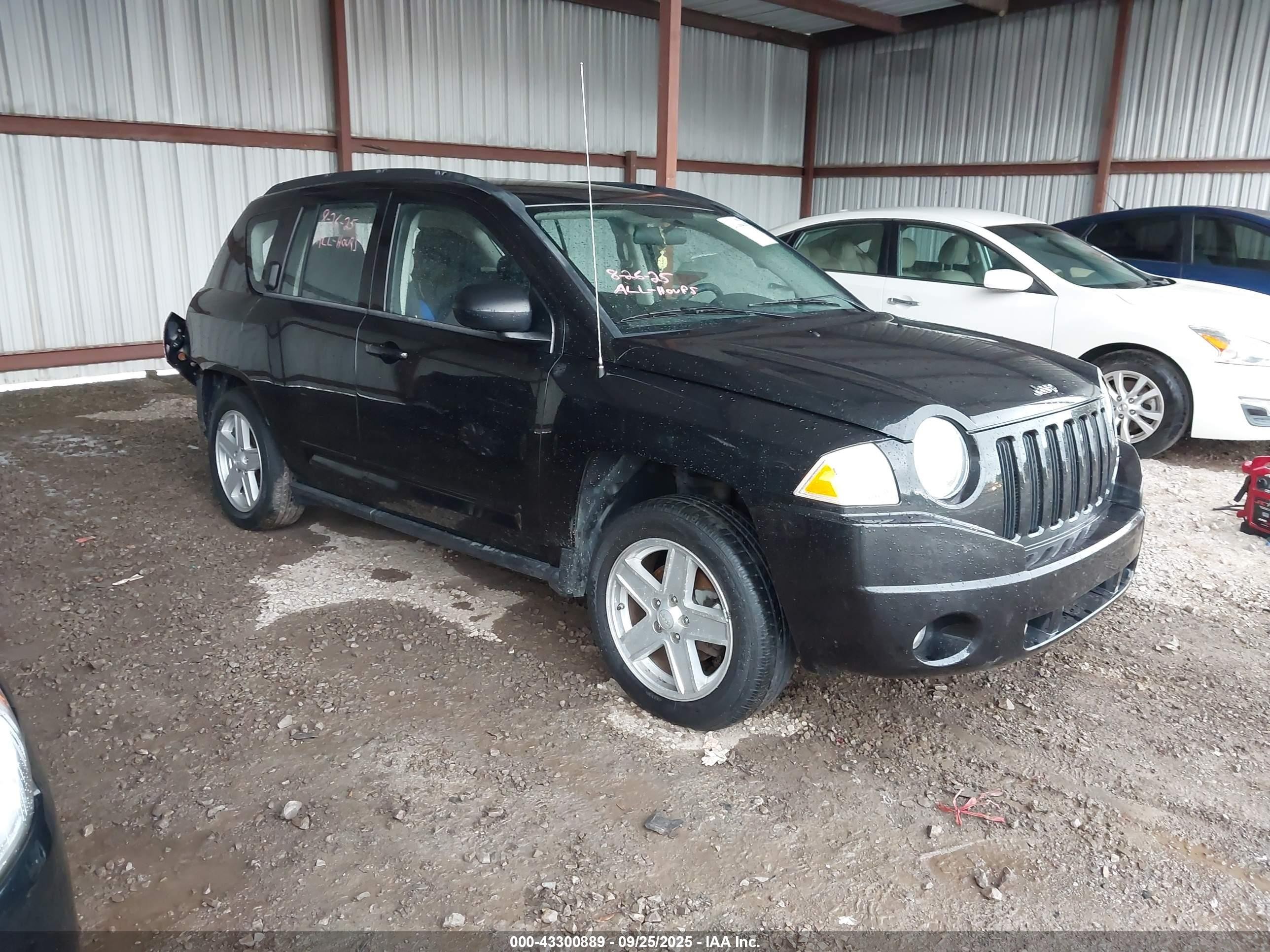 2010 Jeep Compass Sport, VIN 1J4NT4FB1AD574267 — Rear end