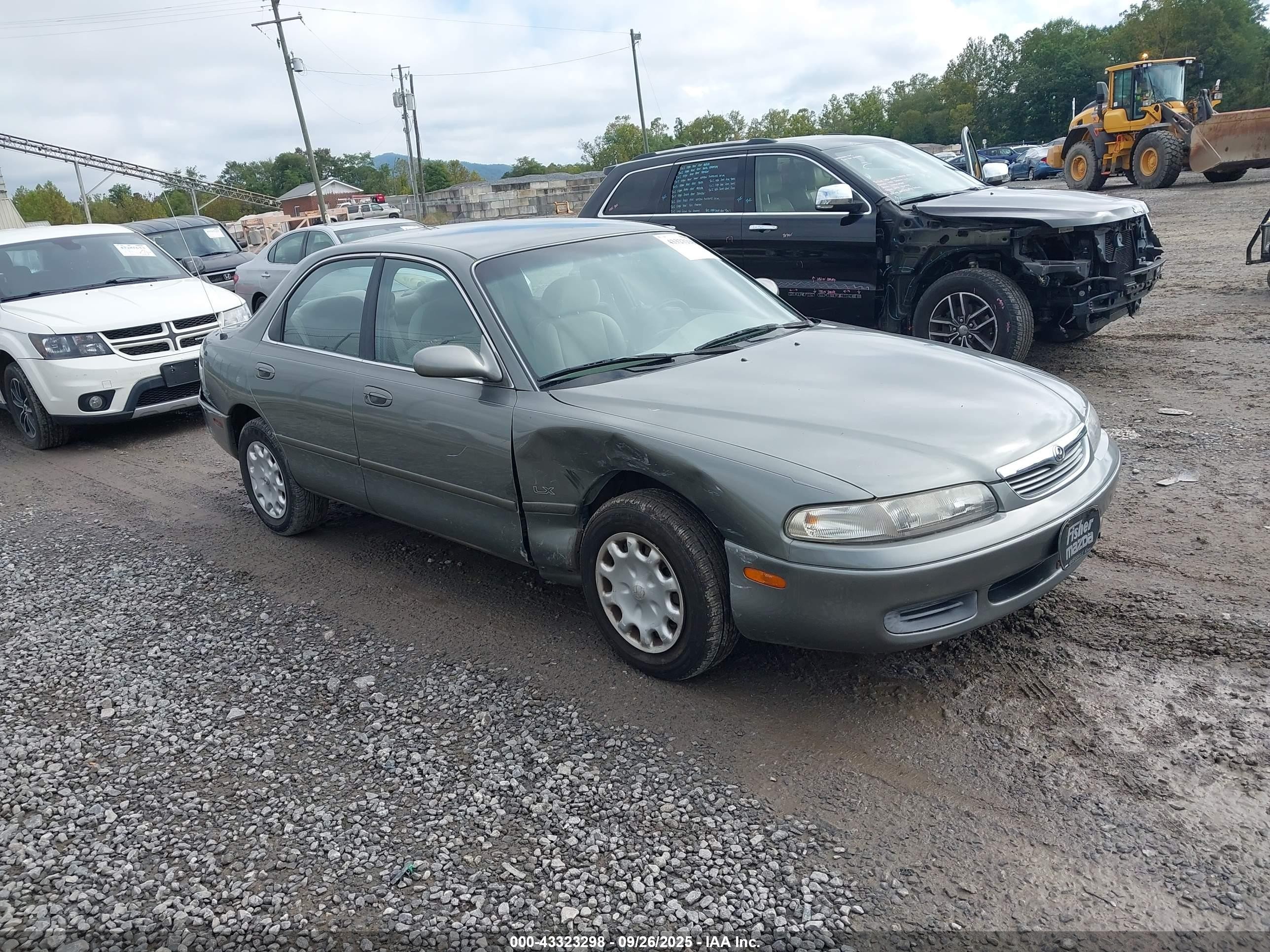 1997 Mazda 626 DX, VIN 1YVGE22C3V5631655 — Side