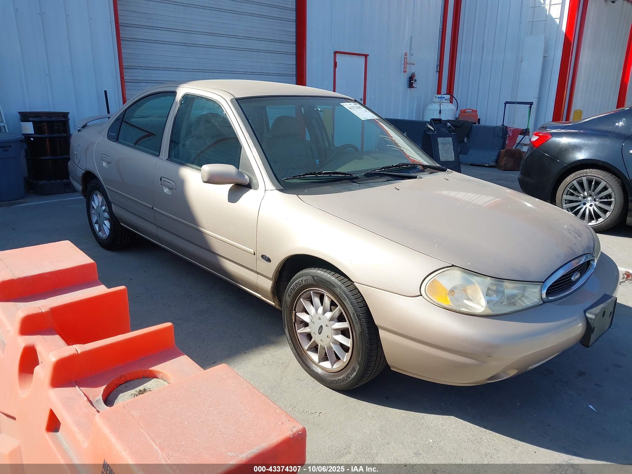 1999 Ford Contour SE, VIN 1FAFP6637XK214563 — Side