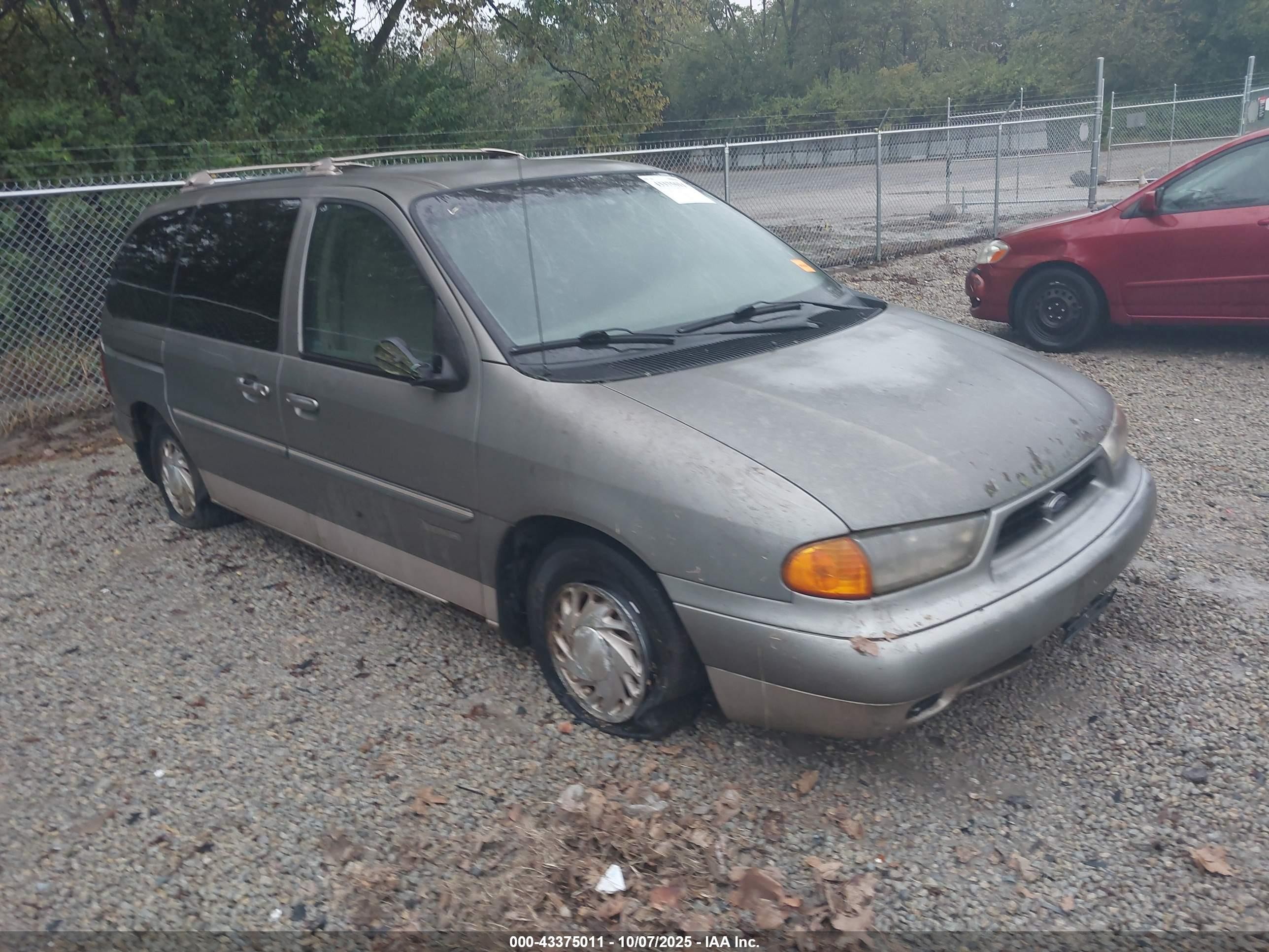 1998 Ford Windstar LX, VIN 2FMZA5143WBC93544 — Side
