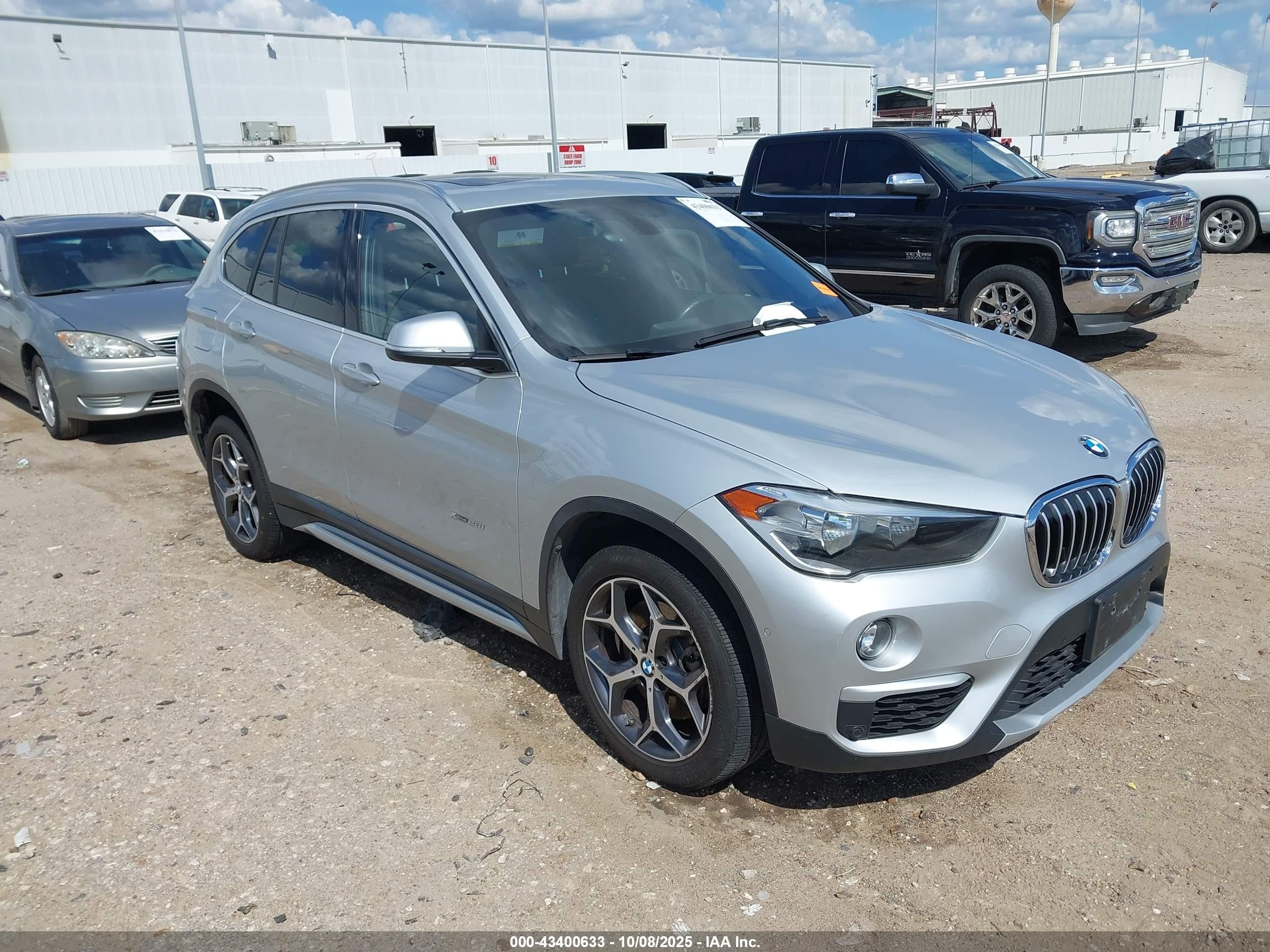 2018 BMW X1 xDrive28i, VIN WBXHT3C38J5L26332 — Rear end