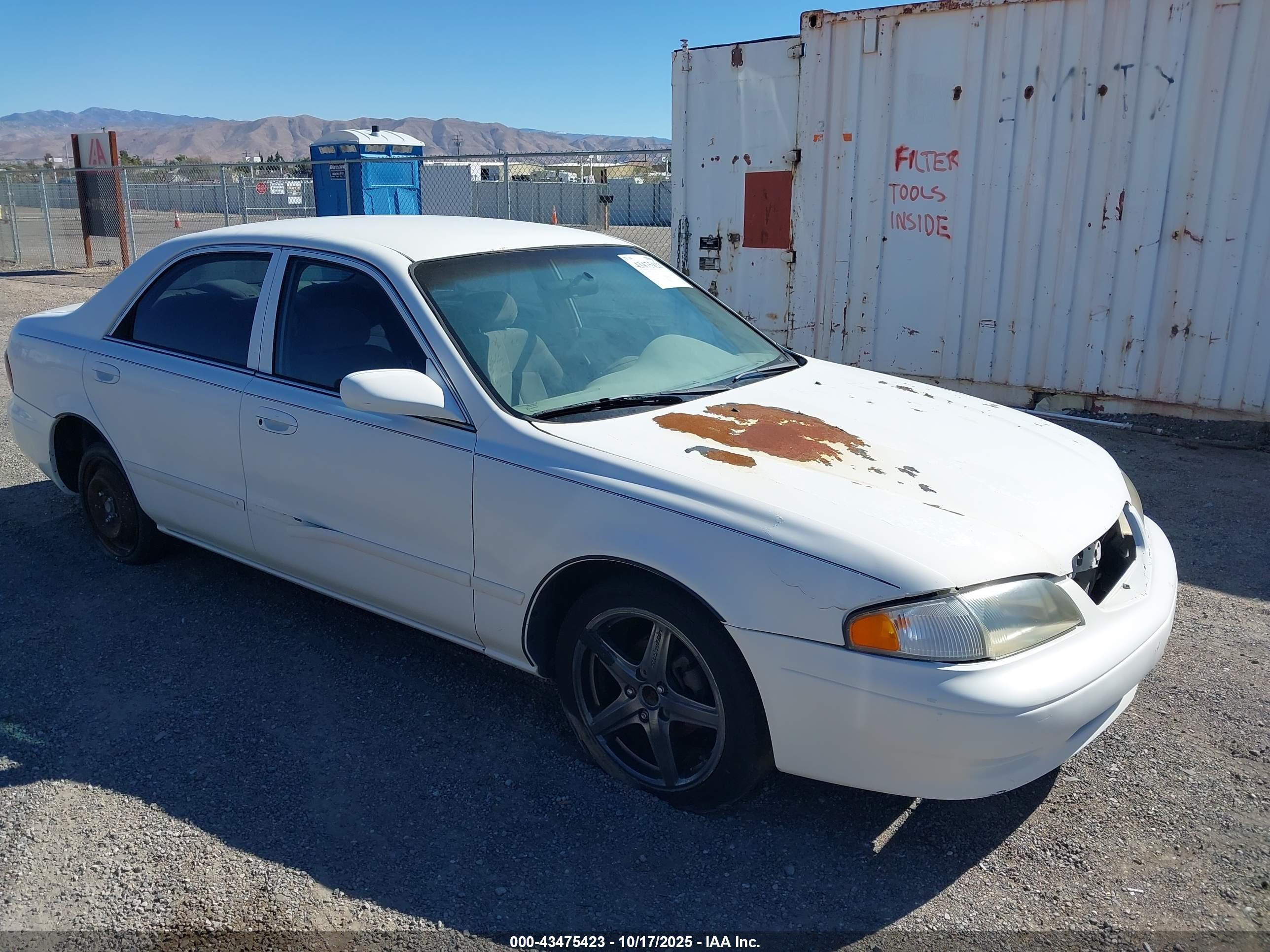 2001 Mazda 626 LX, VIN 1YVGF22C615210665 — Обычный износ