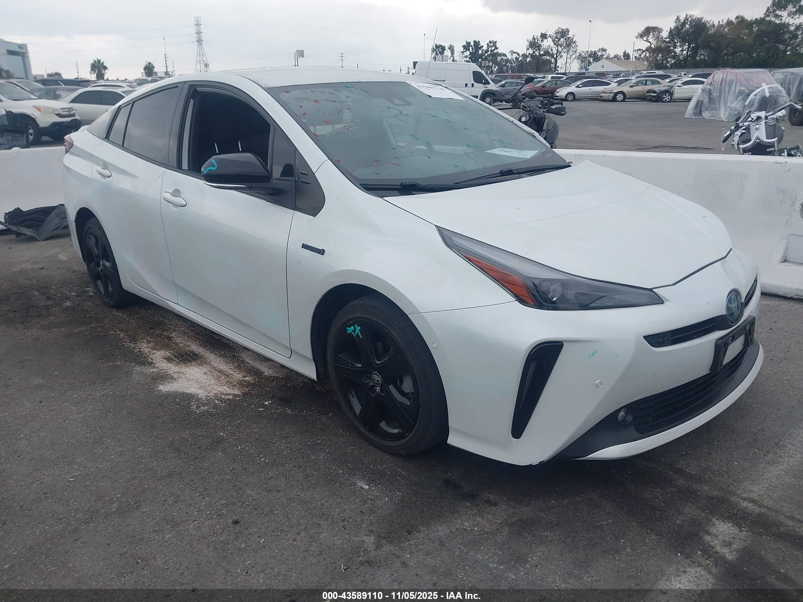 2021 Toyota Prius L Eco, VIN JTDKAMFUXM3129214 — Side