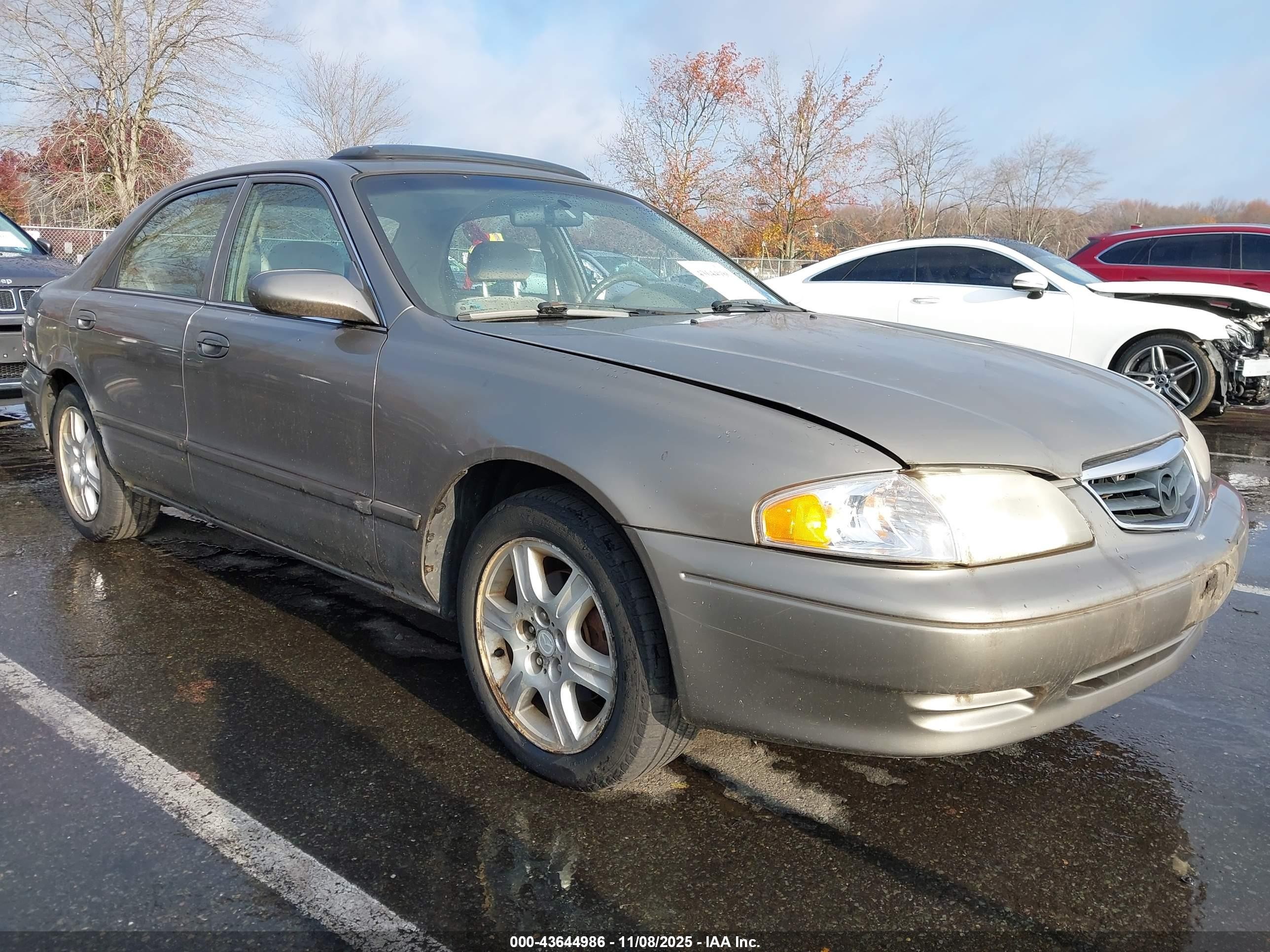 2001 Mazda 626 LX, VIN 1YVGF22D015203266 — По всему кузову
