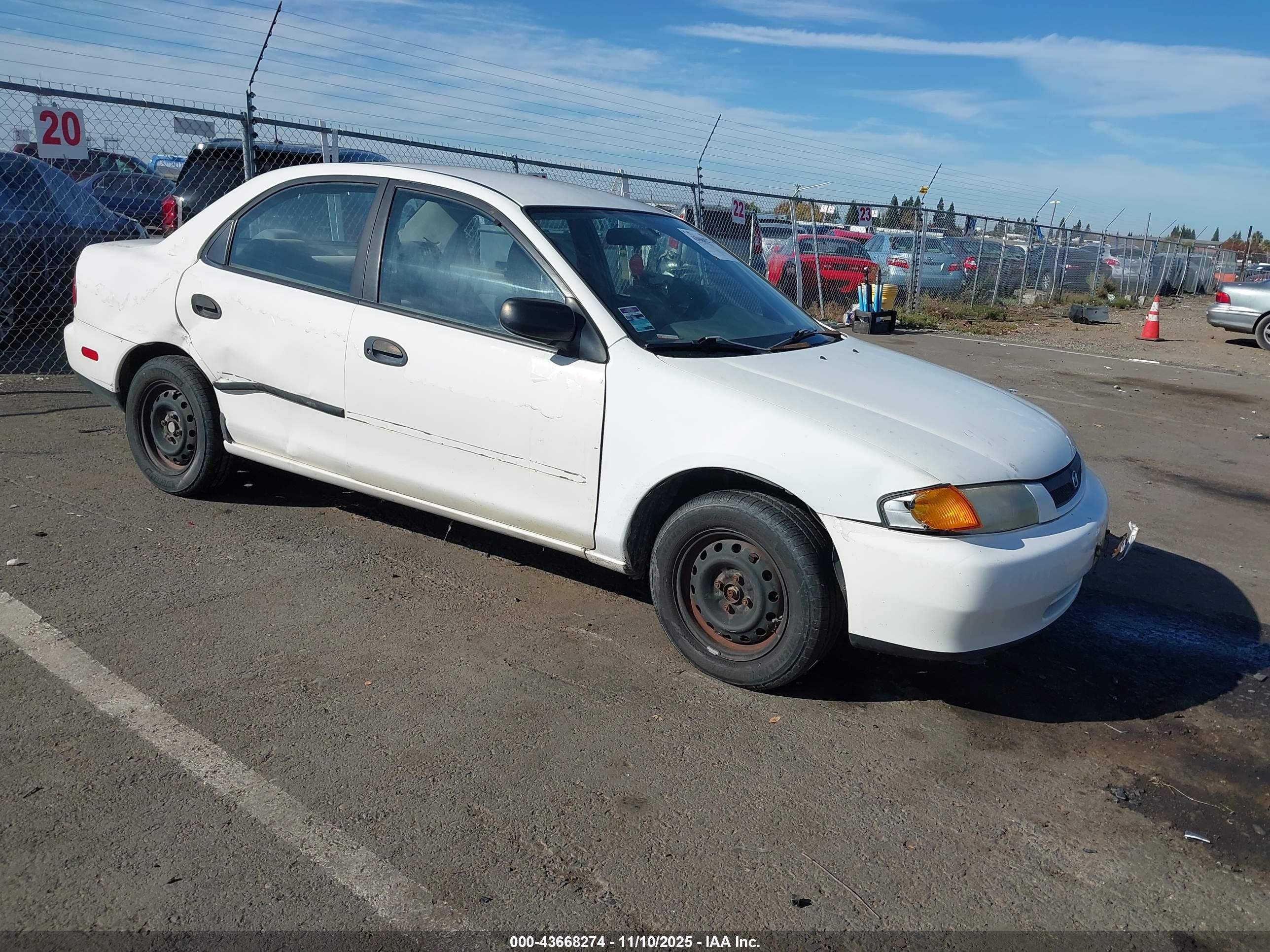 1998 Mazda Protege DX, VIN JM1BC1411W0218000 — Side
