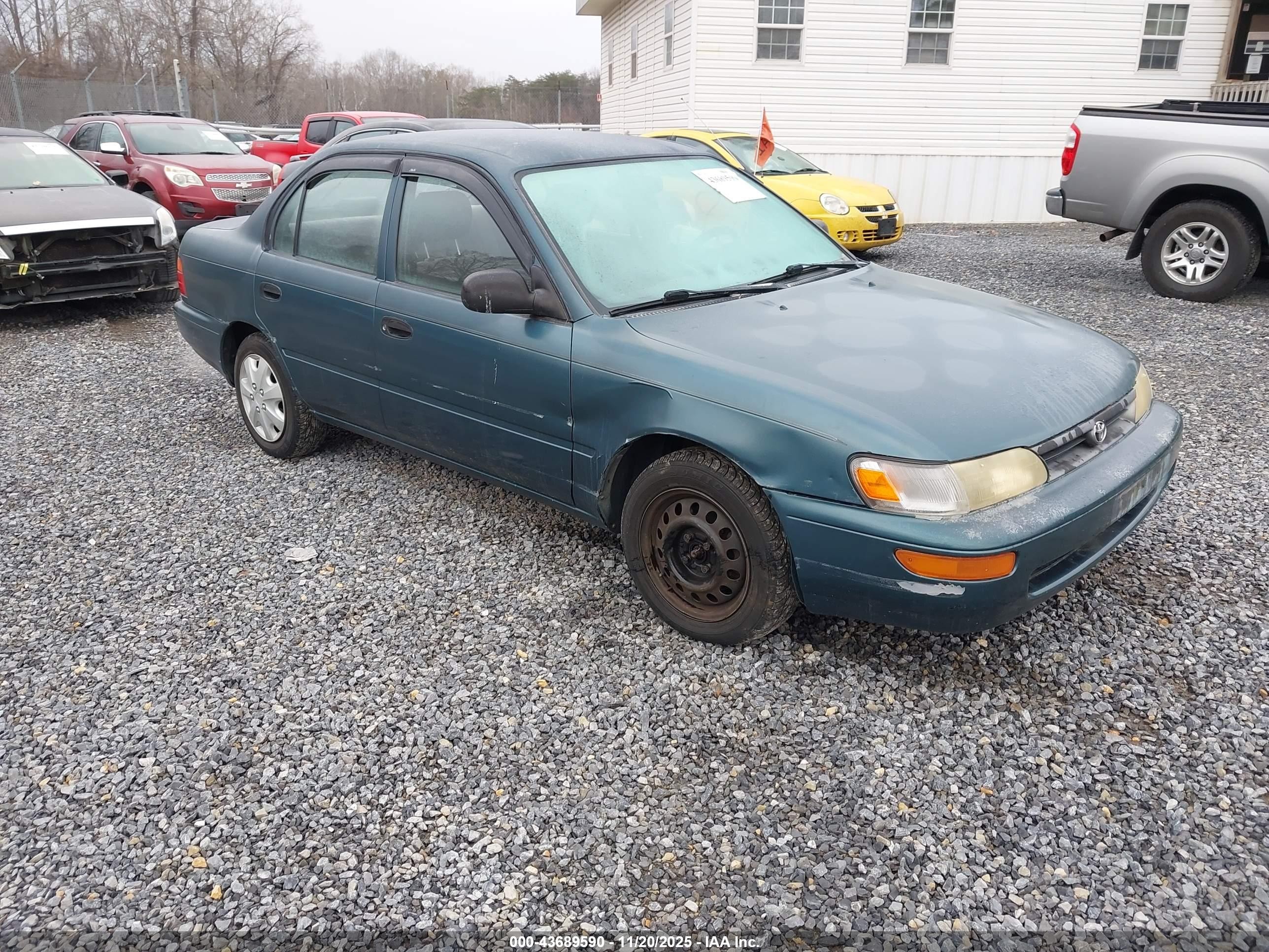 1995 Toyota Corolla, VIN 2T1AE04B8SC065673 — Side