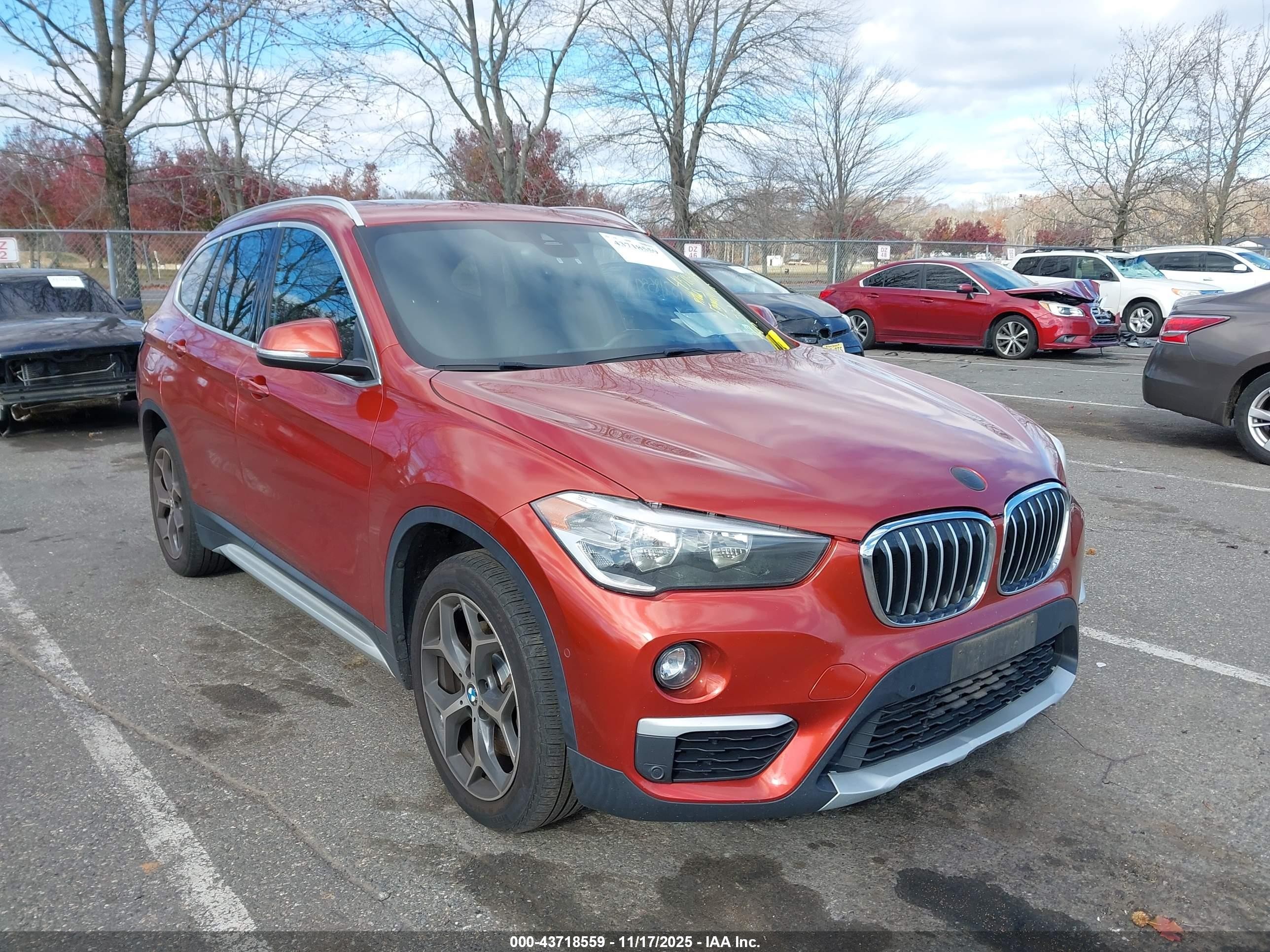 2018 BMW X1 xDrive28i, VIN WBXHT3C31J3H32550 — Side