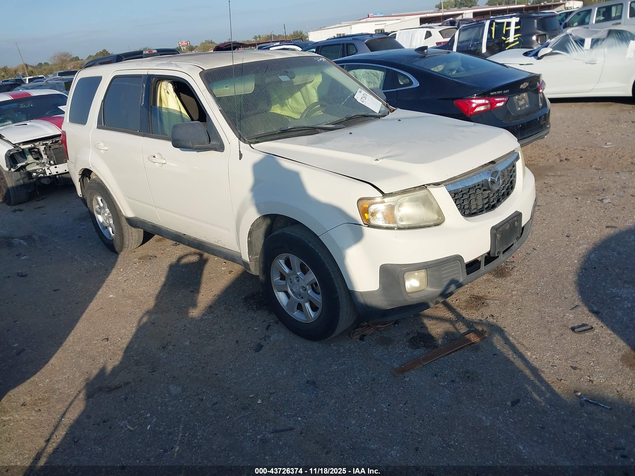2010 Mazda Tribute Sport, VIN 4F2CY0C71AKM02629 — Бок