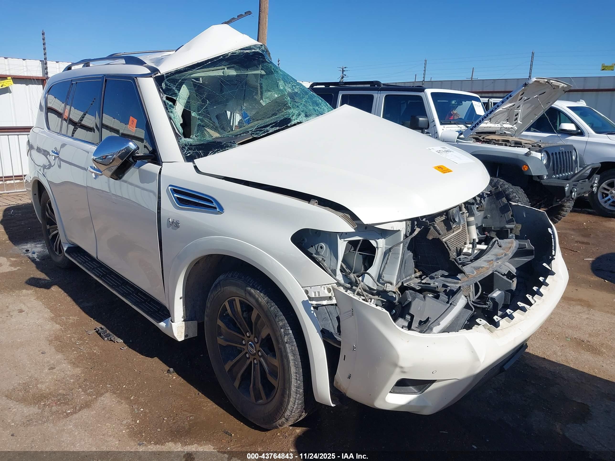 2019 Nissan Armada Platinum, VIN JN8AY2NF7K9351786 — Side