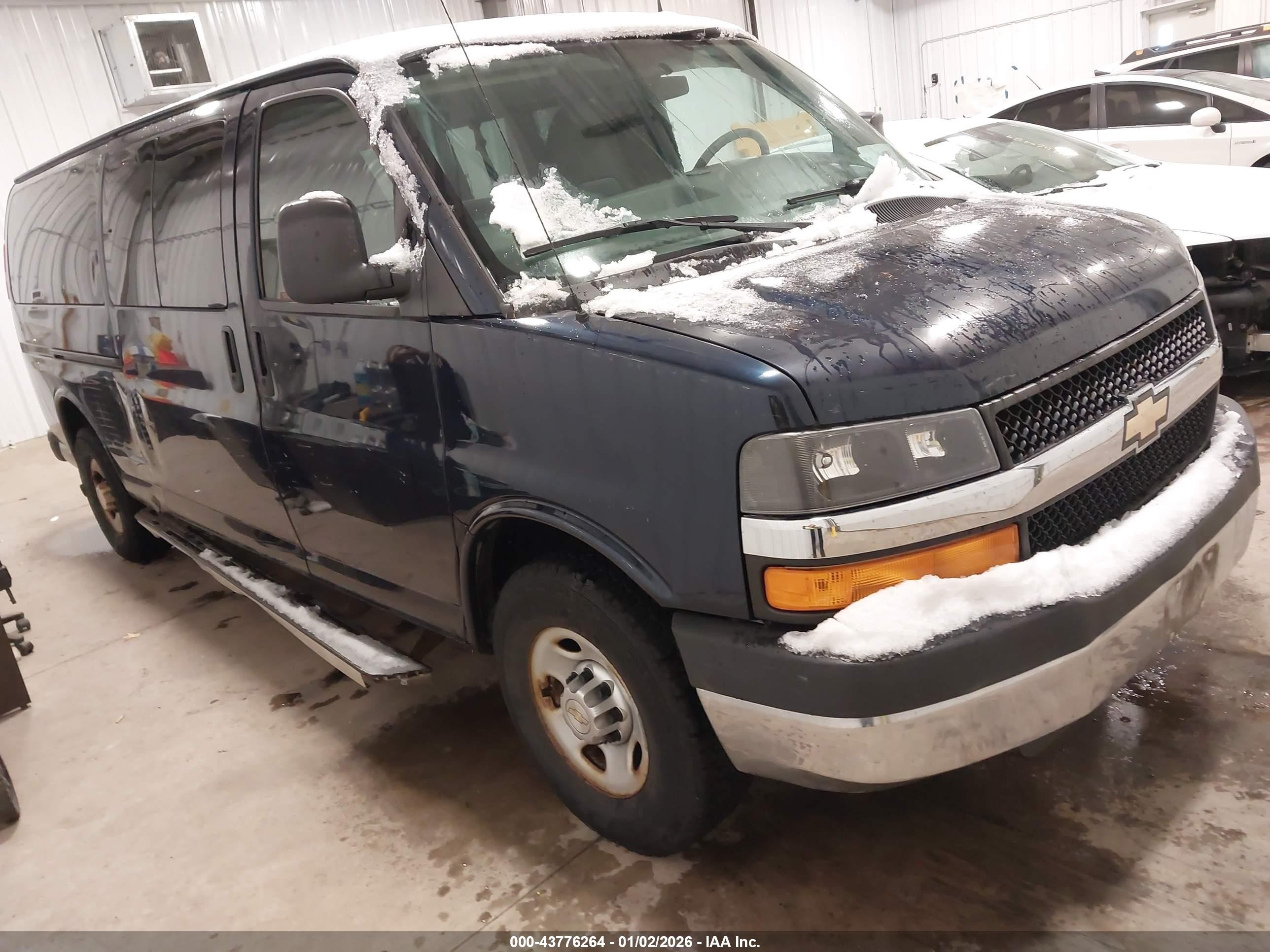 2012 Chevrolet Express Passenger 1LS, VIN 1GAZGZFA3C1151025 — Side