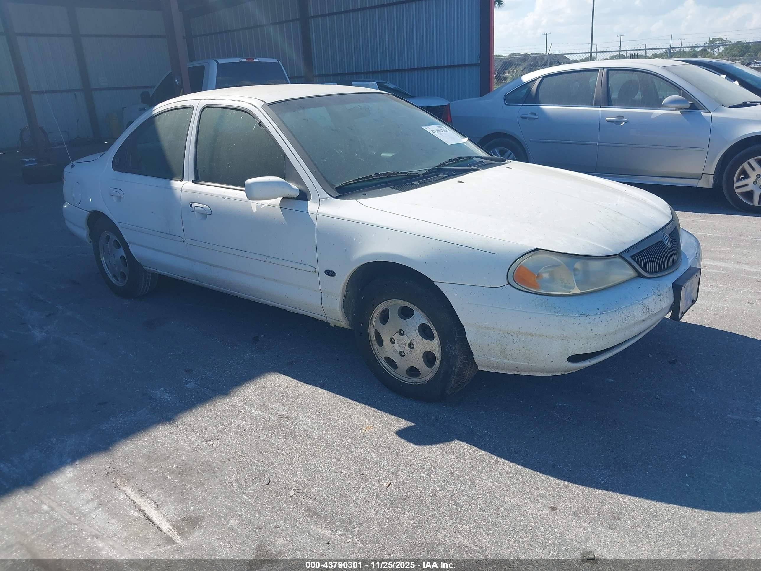 1999 Mercury Mystique GS, VIN 1MEFM6533XK626854 — Side