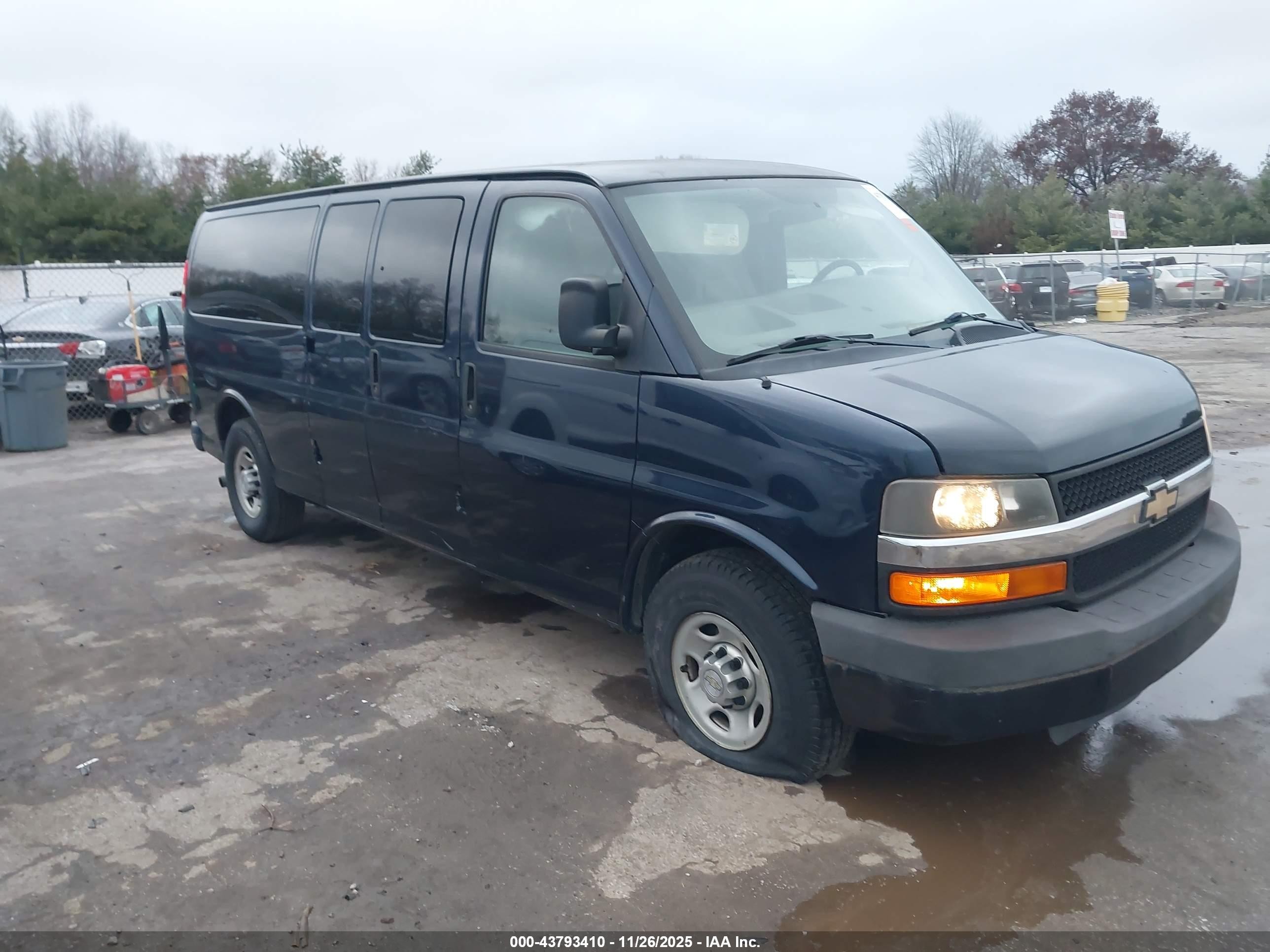 2011 Chevrolet Express Passenger 1LS, VIN 1GAZGZFGXB1158167 — Side