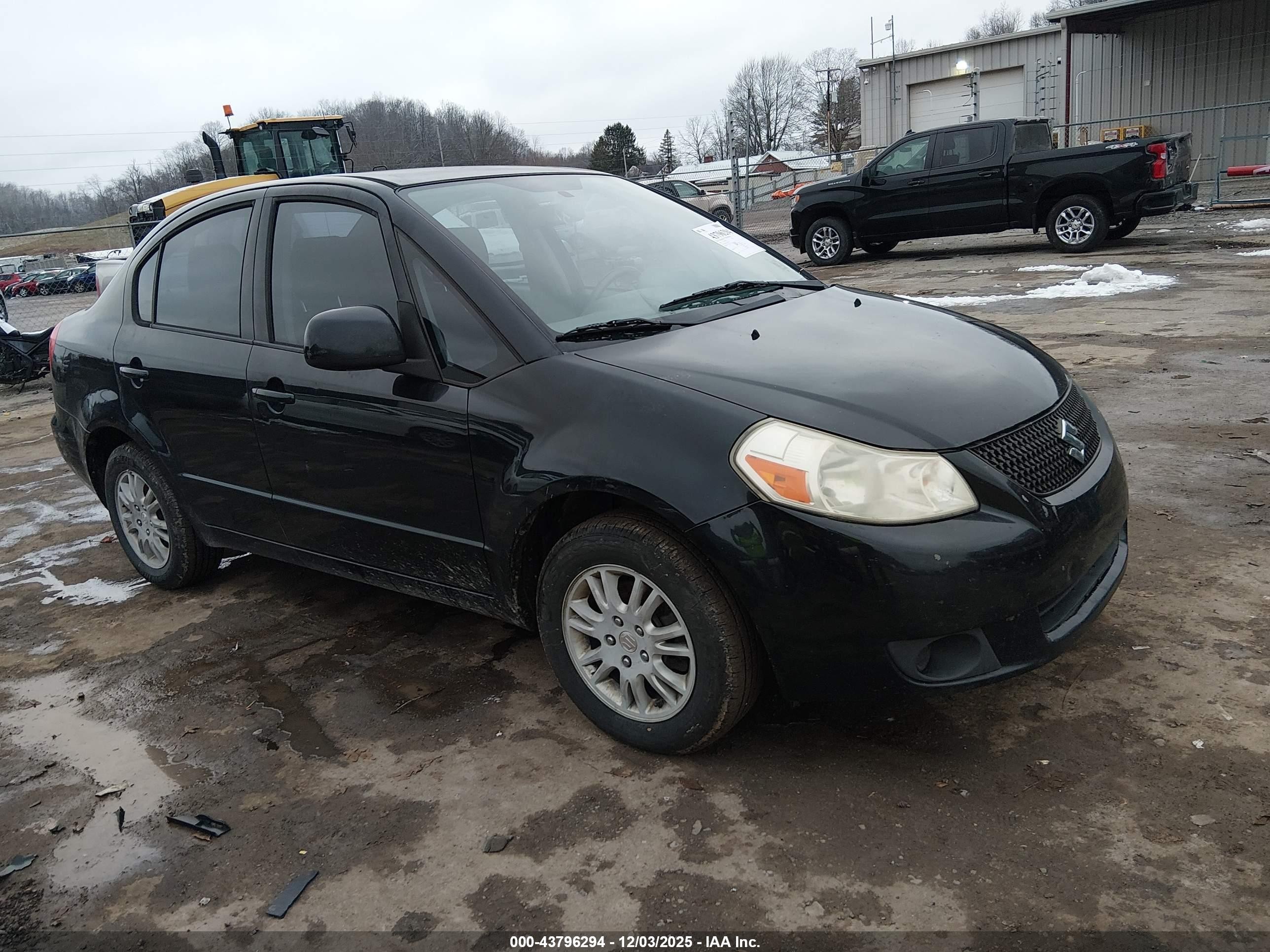 2012 Suzuki SX4 LE, VIN JS2YC5A38C6302272 — Side