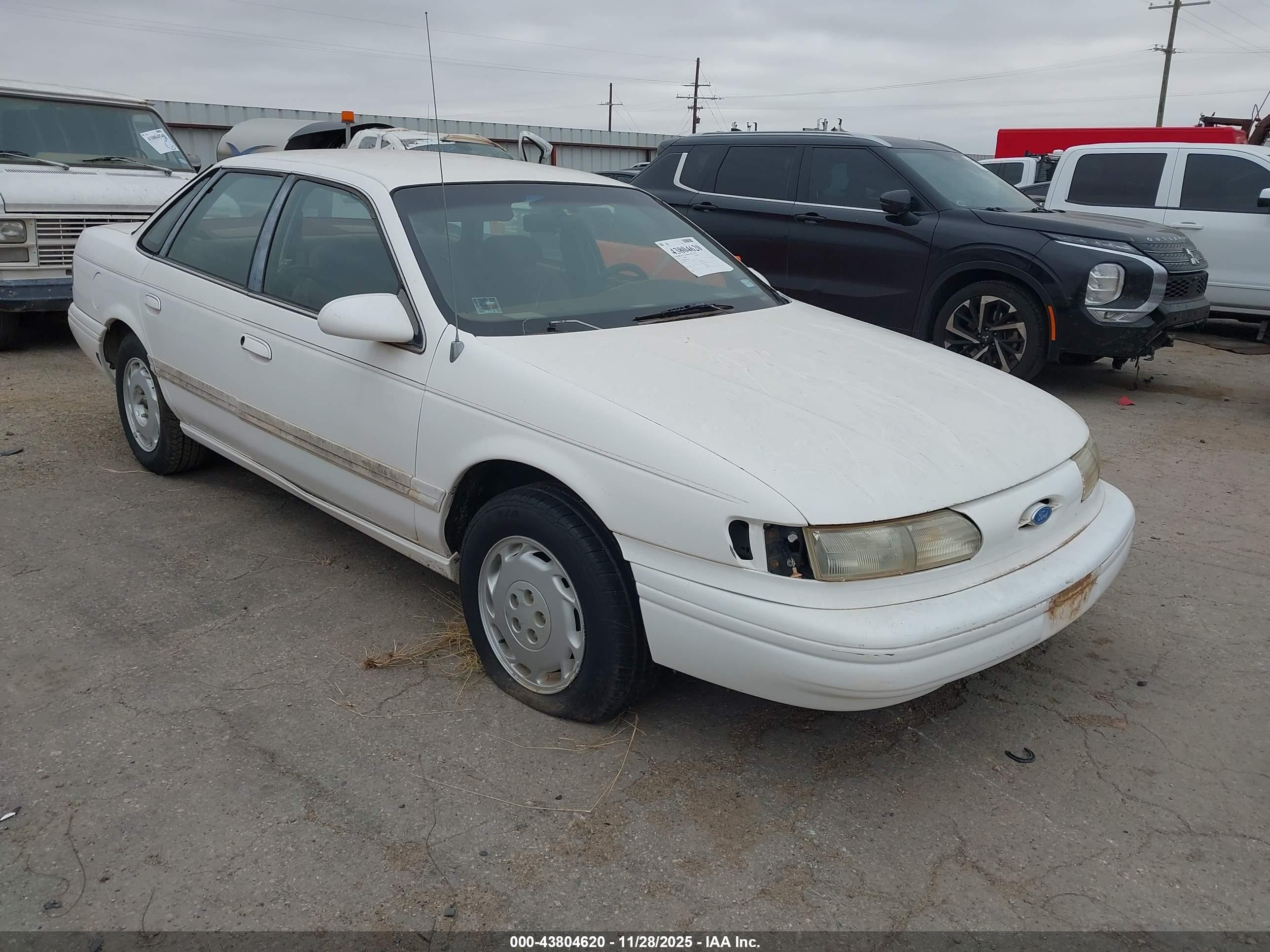 1994 Ford Taurus GL, VIN 1FALP5246RG184456 — Side