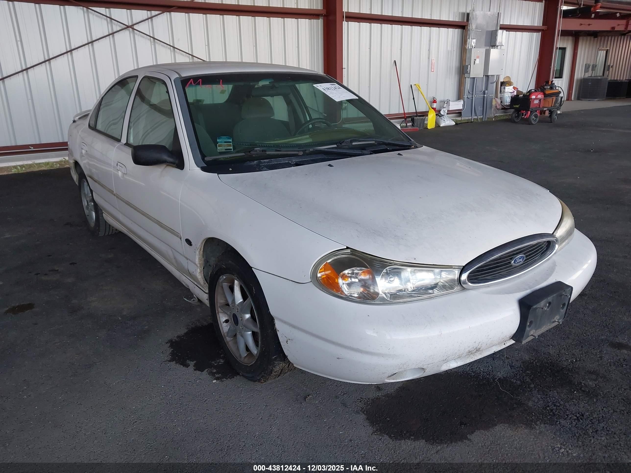 1999 Ford Contour LX, VIN 1FAFP66L7XK208536 — Normal wear