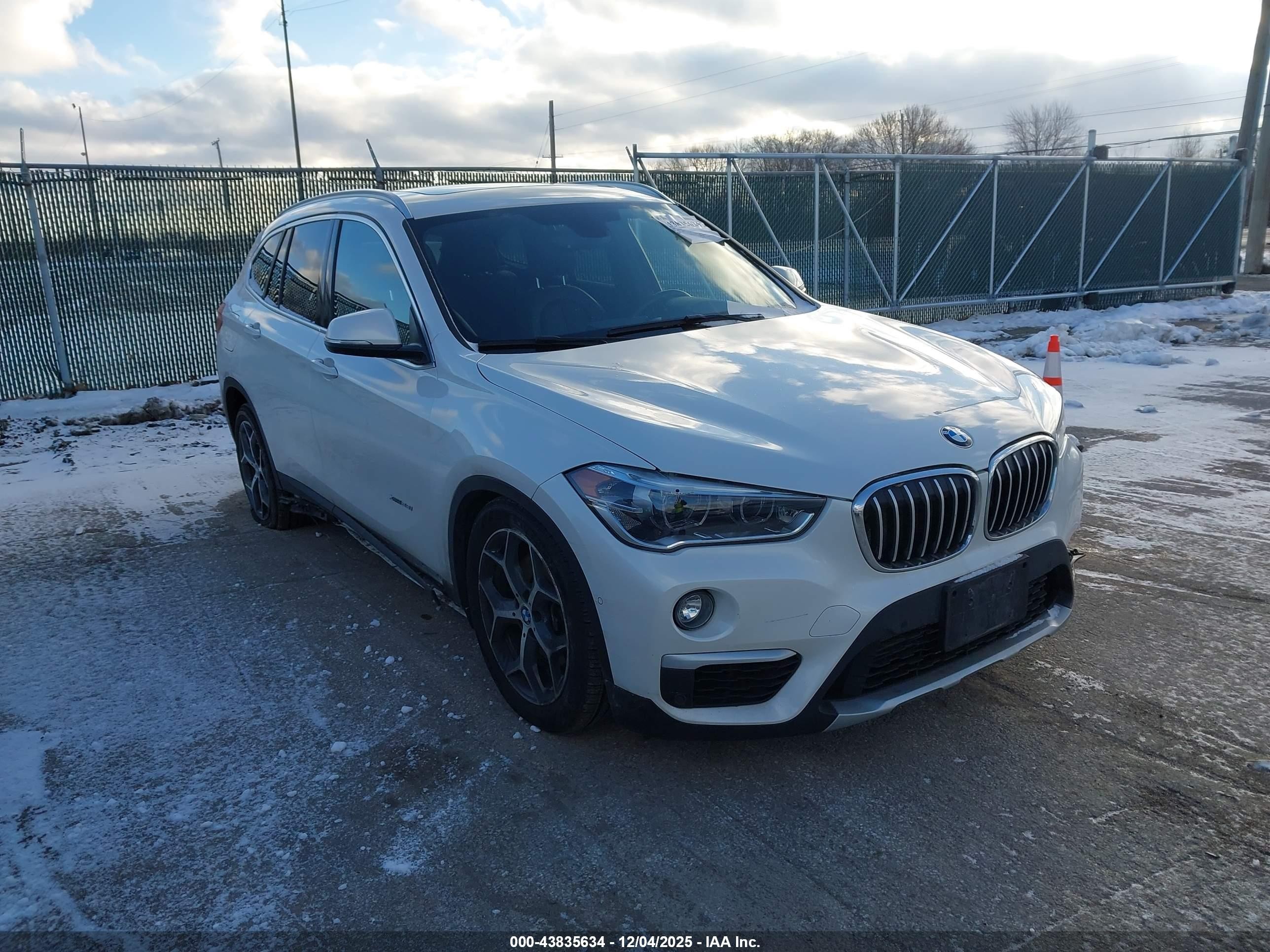 2018 BMW X1 xDrive28i, VIN WBXHT3C35J5K26804 — Side