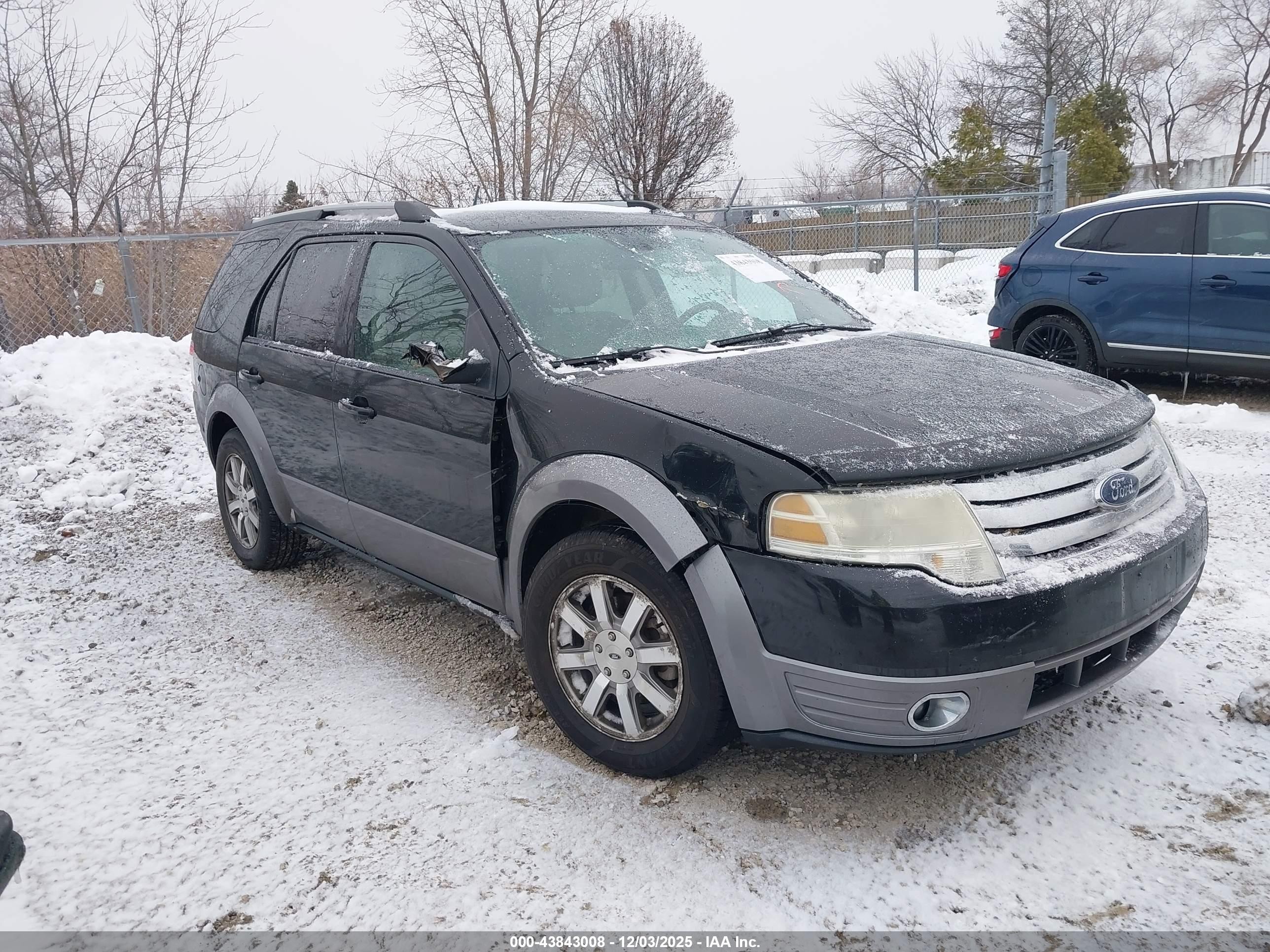 2009 Ford Taurus X SEL, VIN 1FMDK02W49GA01438 — Side