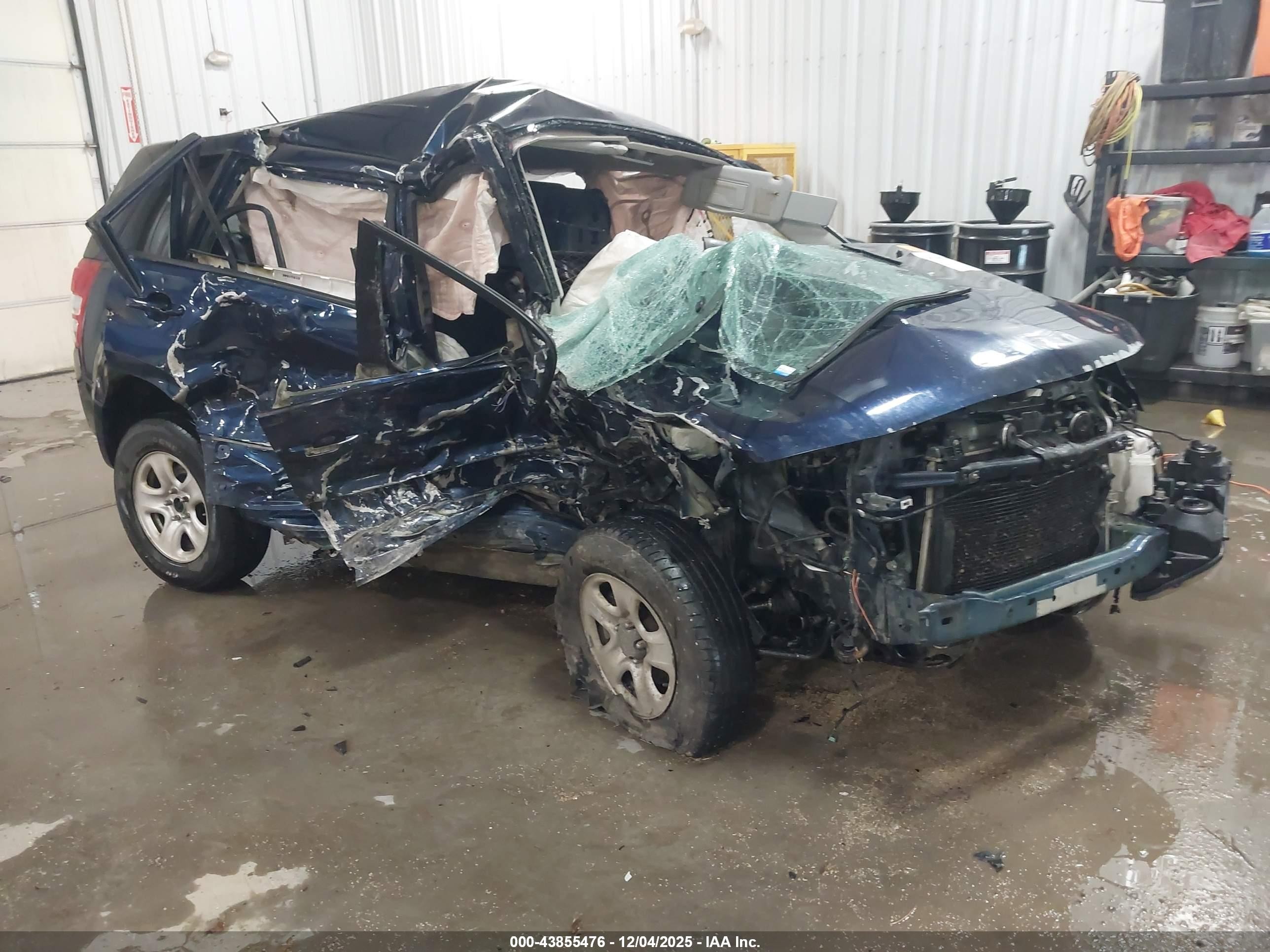 2012 Suzuki Grand Vitara Premium, VIN JS3TD0D26C4100471 — Бок