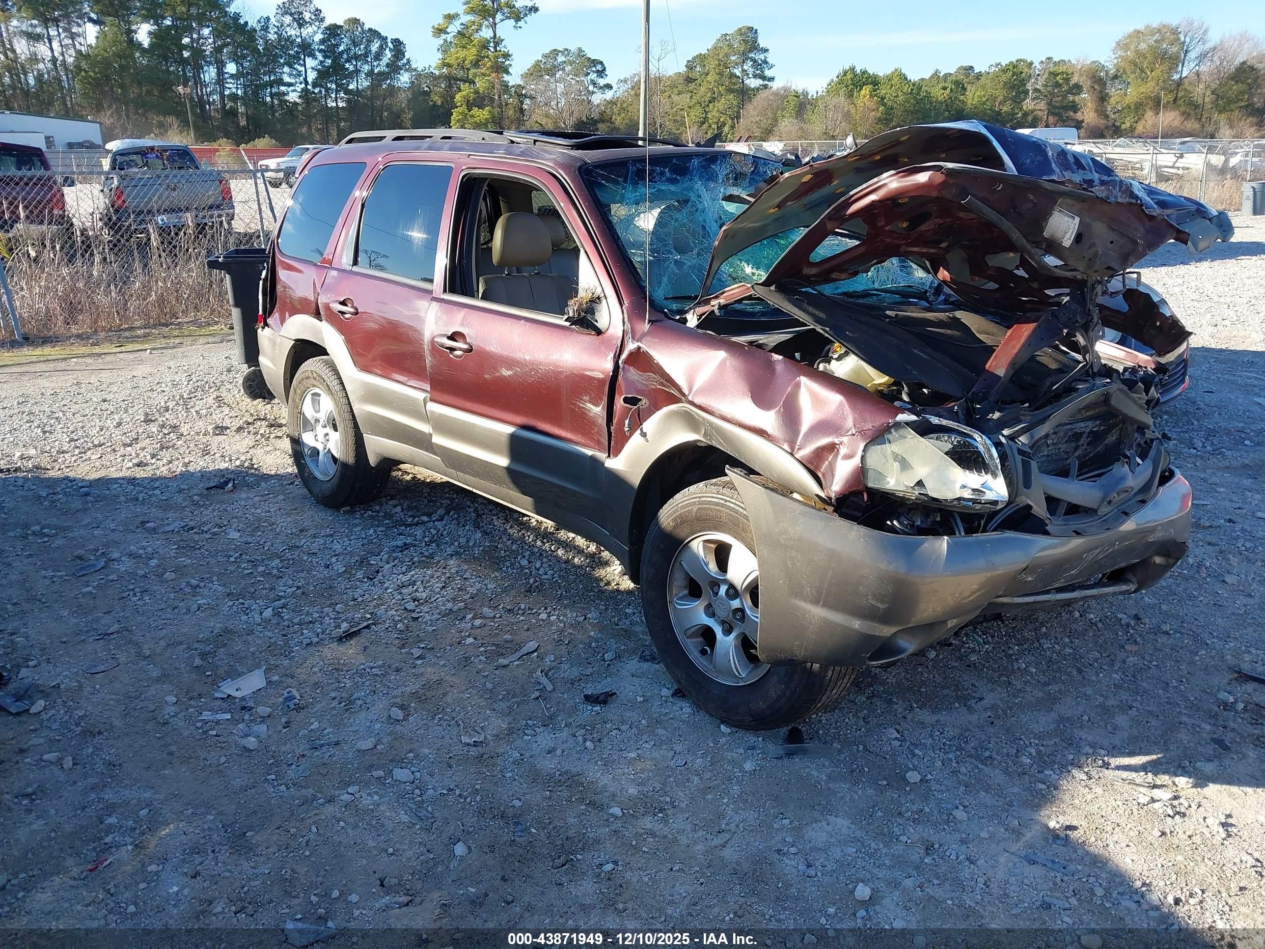 2002 Mazda Tribute LX, VIN 4F2CU09162KM55004 — Rollover