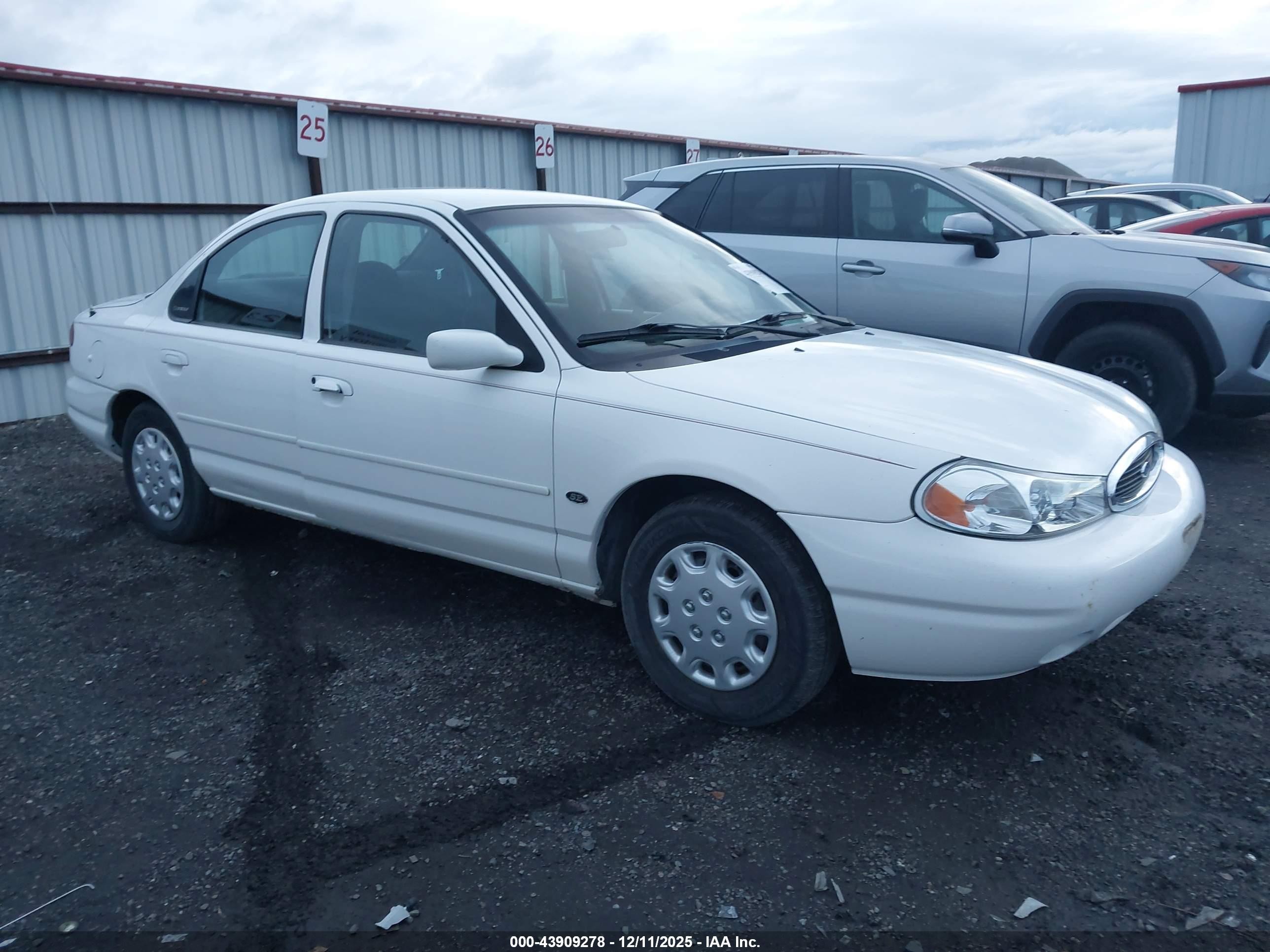 1999 Ford Contour SE, VIN 1FAFP663XXK193658 — Side
