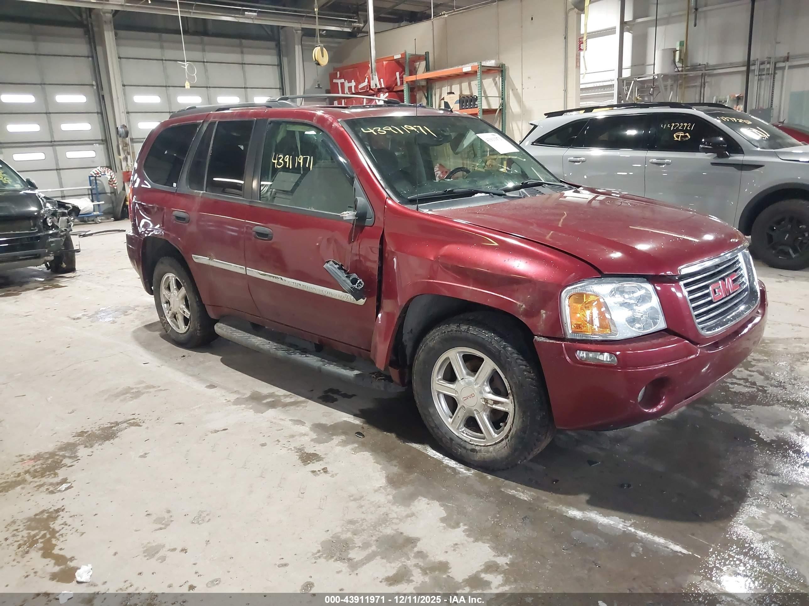 2009 GMC Envoy SLE, VIN 1GKDT33S792103414 — Side