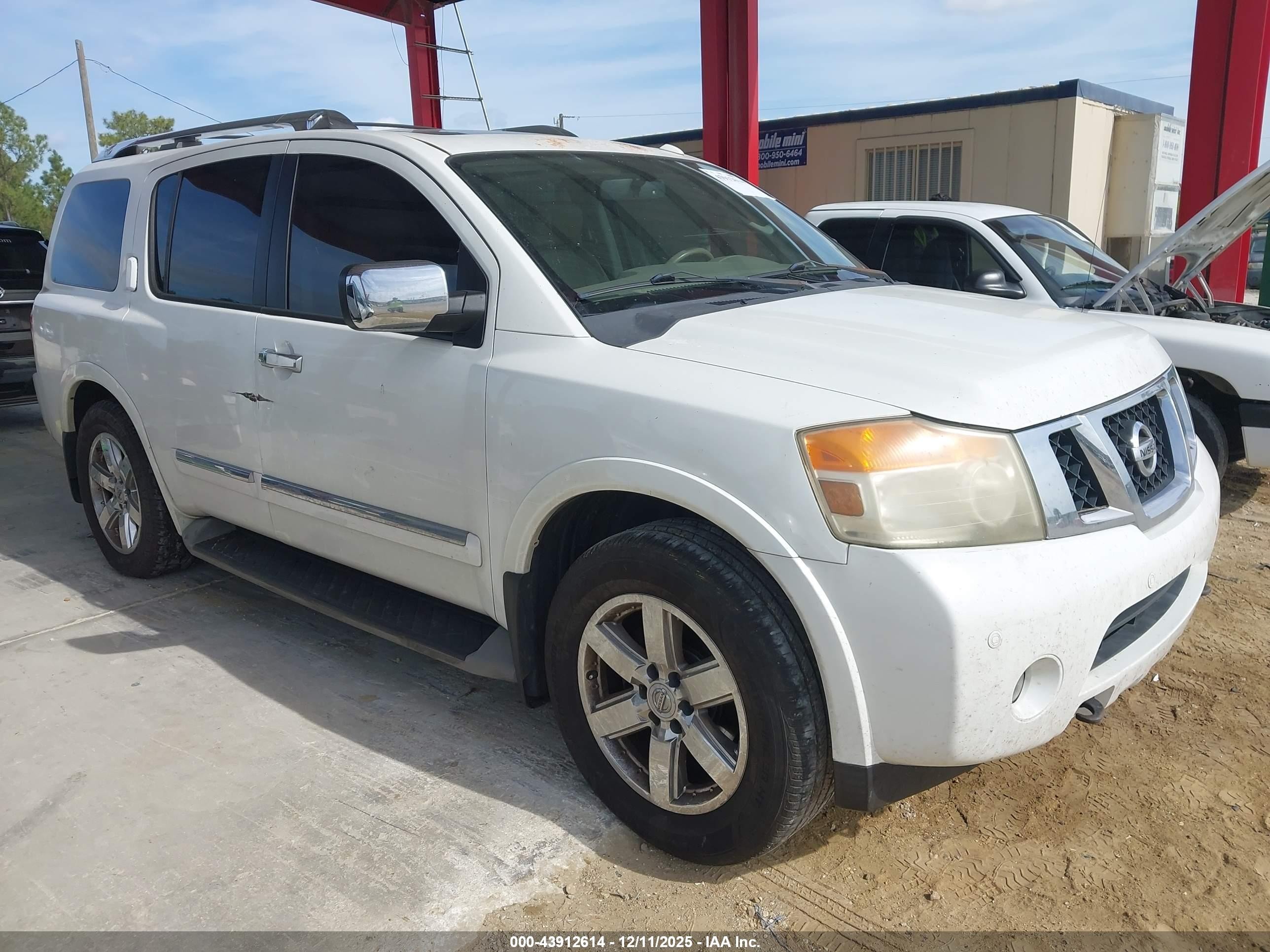 2011 Nissan Armada Platinum, VIN 5N1AA0NC7BN609284 — Side