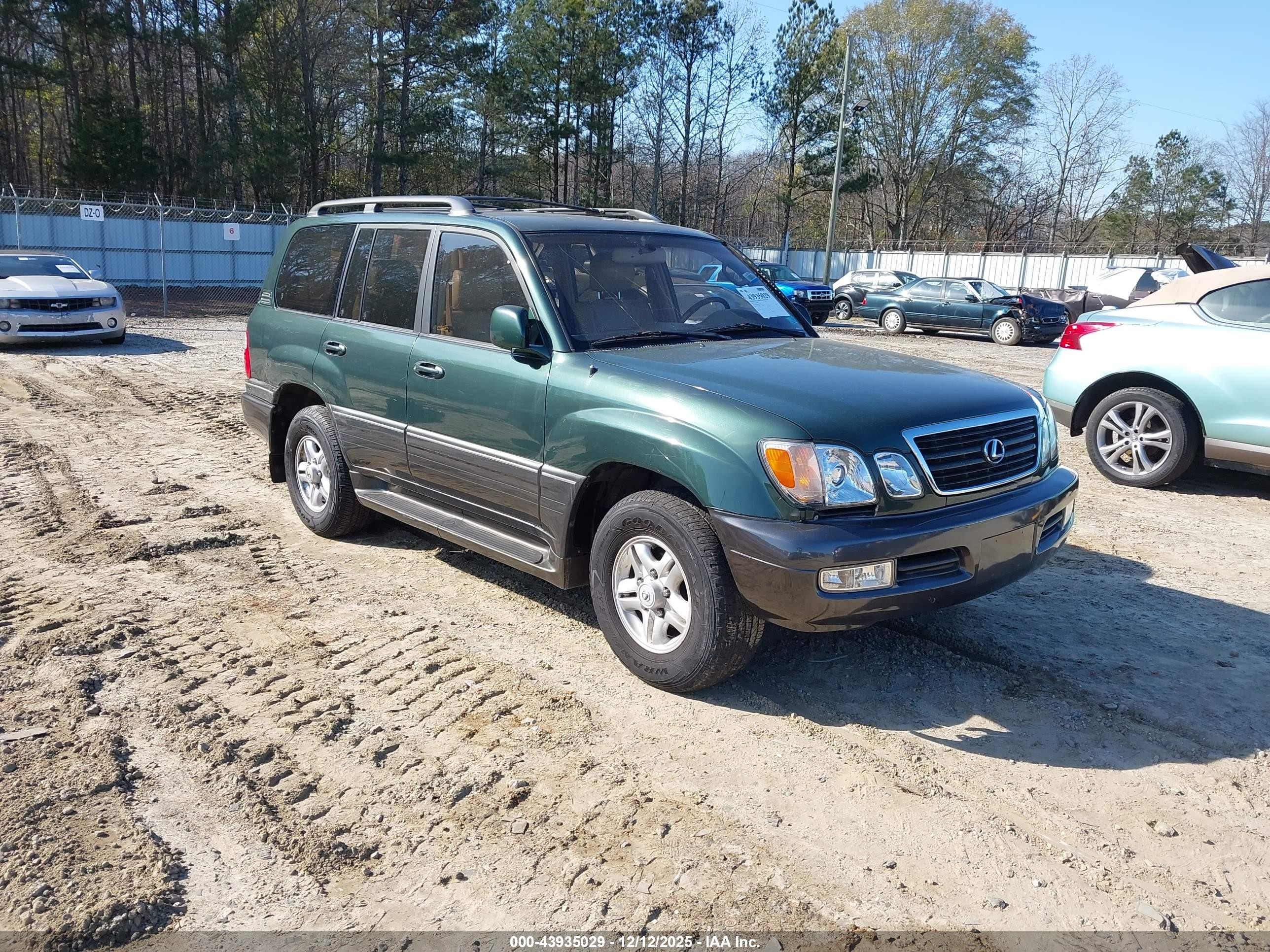 1998 Lexus LX 470, VIN JT6HT00W5W0016385 — Бок