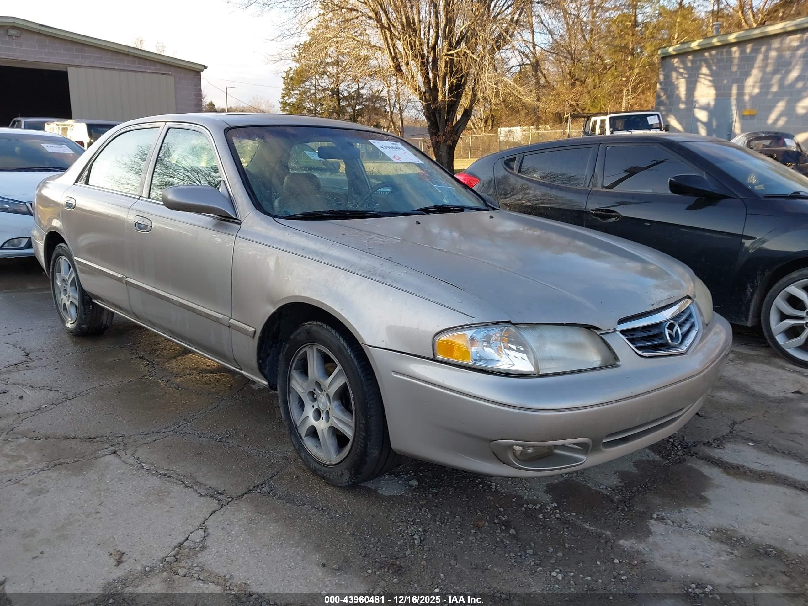 2002 Mazda 626 LX, VIN 1YVGF22D325285429 — Side