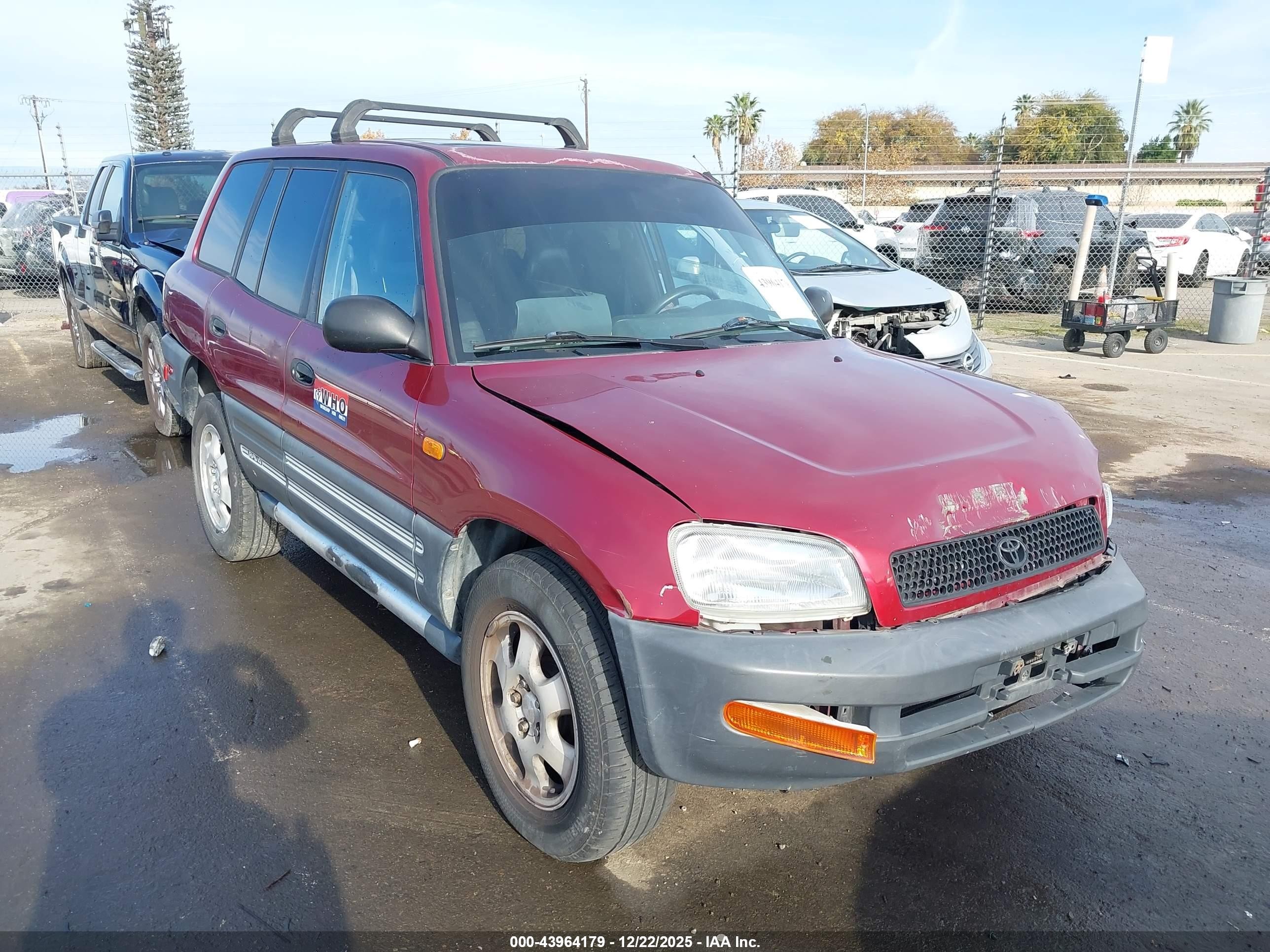 1997 Toyota RAV4, VIN JT3HP10V7V7042300 — Side