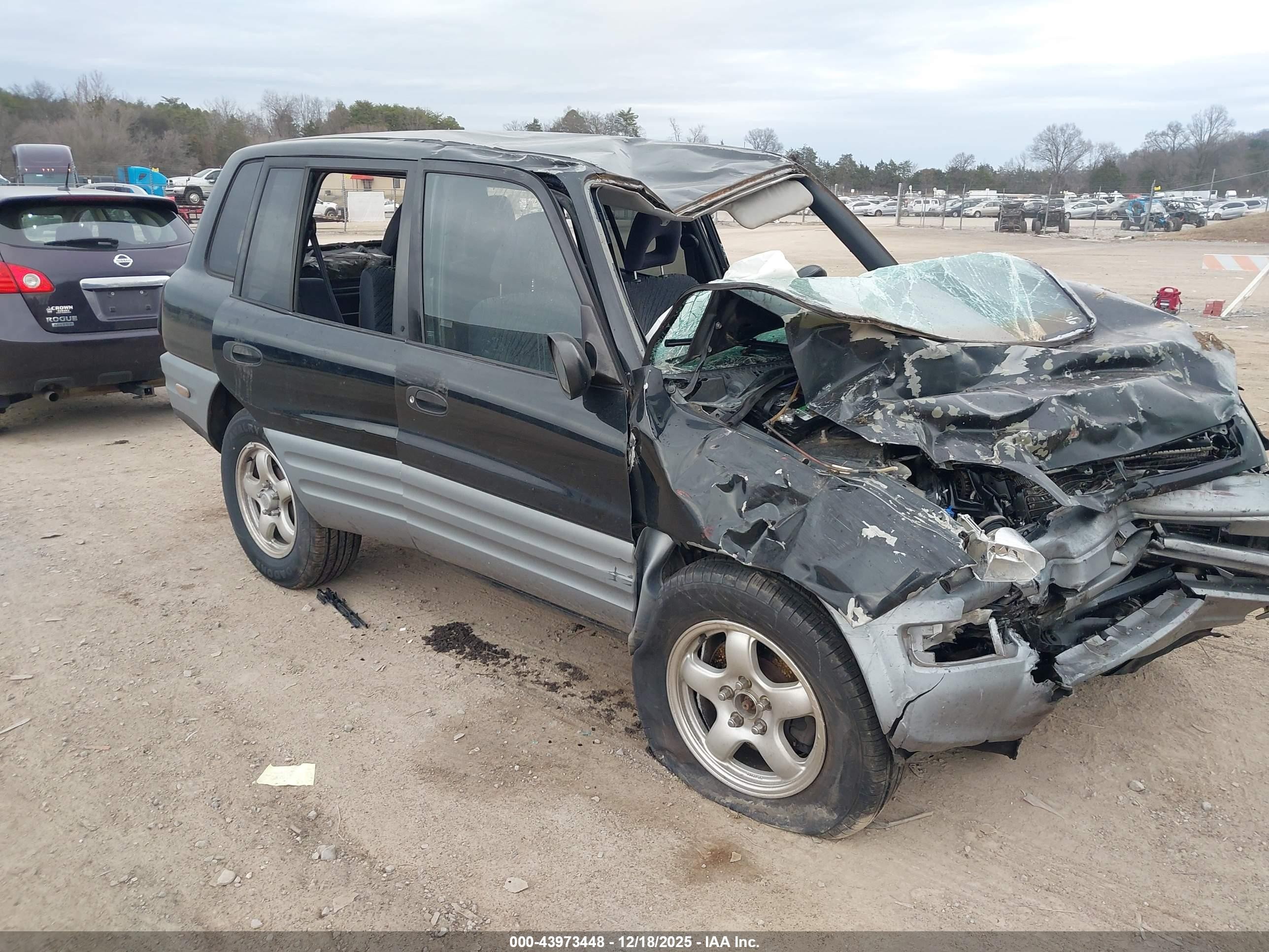 1998 Toyota RAV4, VIN JT3GP10V7W7031648 — Rollover