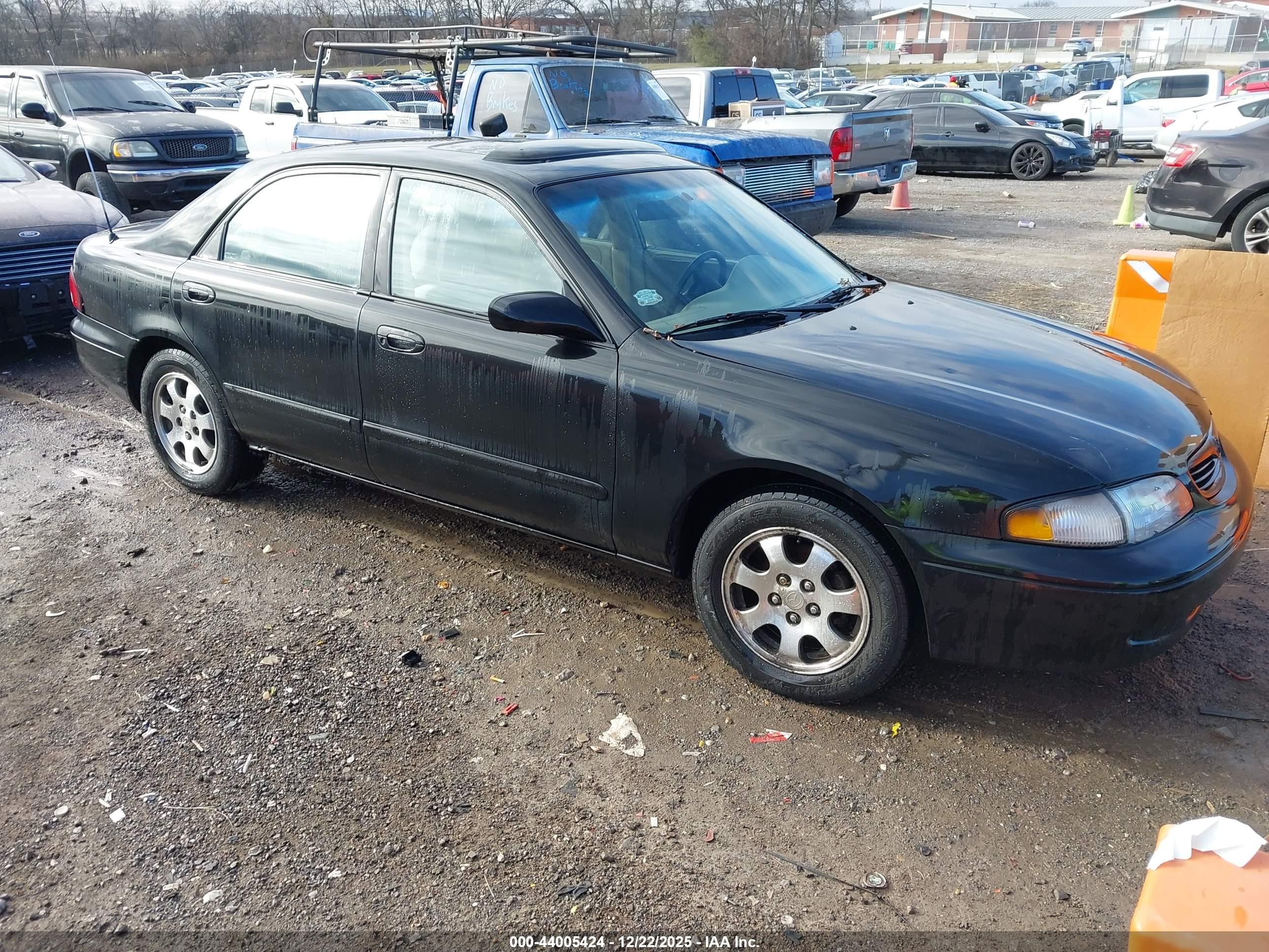 1999 Mazda 626 ES, VIN 1YVGF22C7X5893176 — Normal wear
