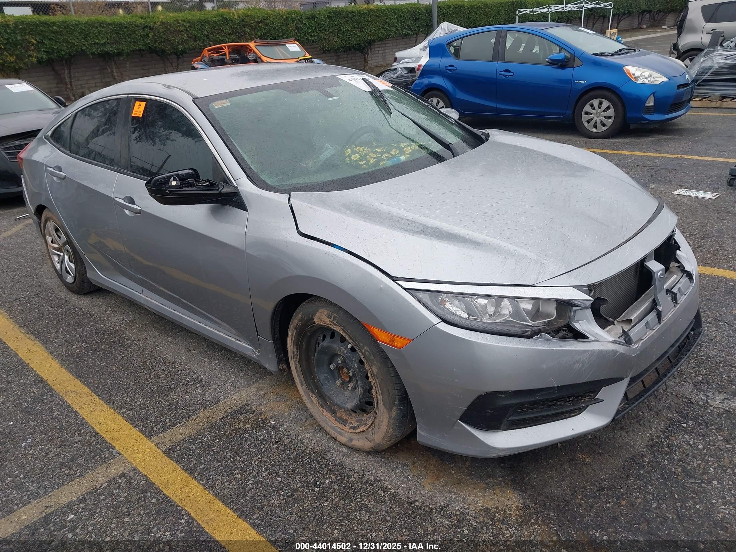 2018 Honda Civic LX, VIN 19XFC2F5XJE010642 — Front end