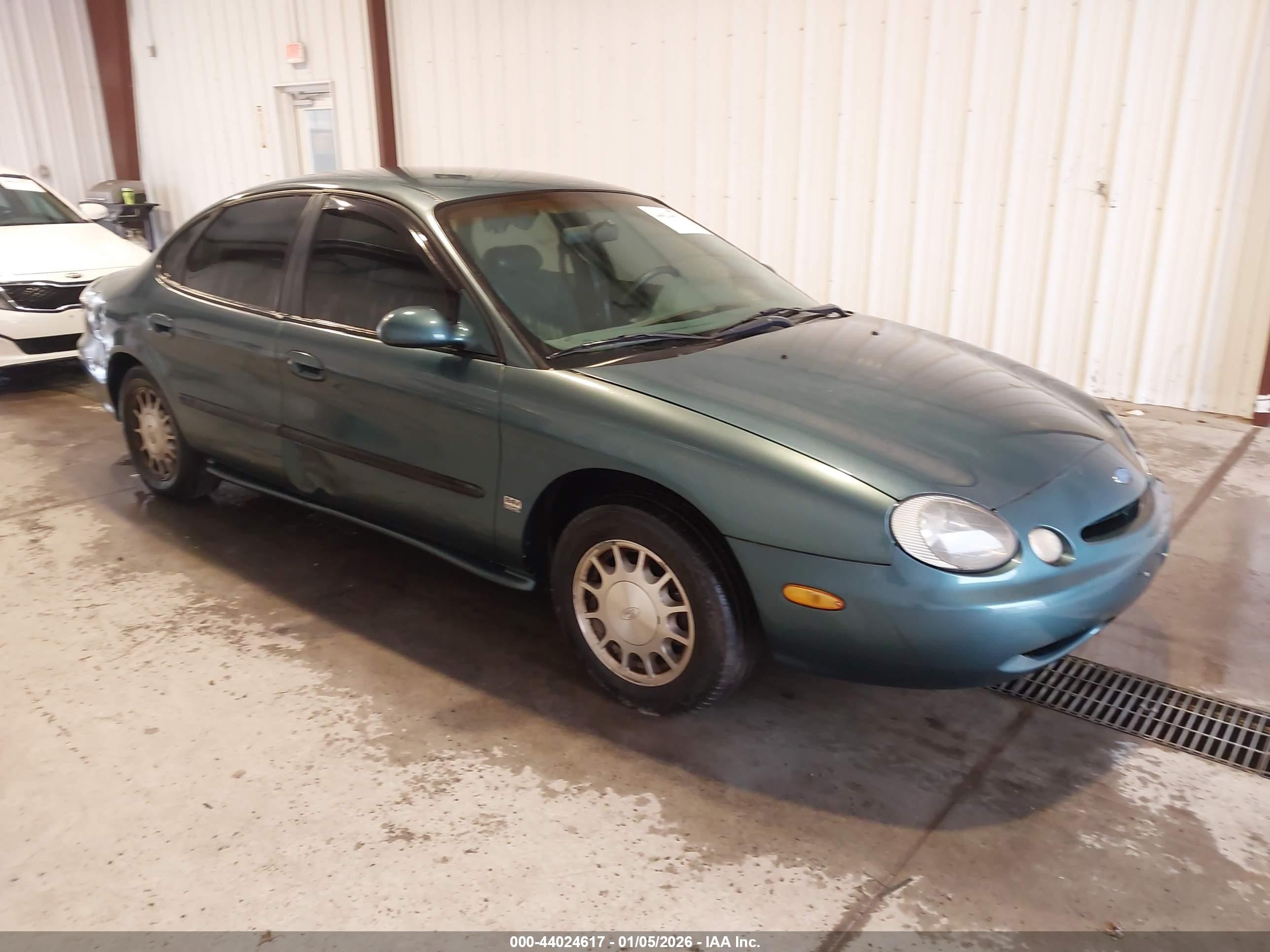 1997 Ford Taurus LX, VIN 1FALP53S4VA174888 — Side