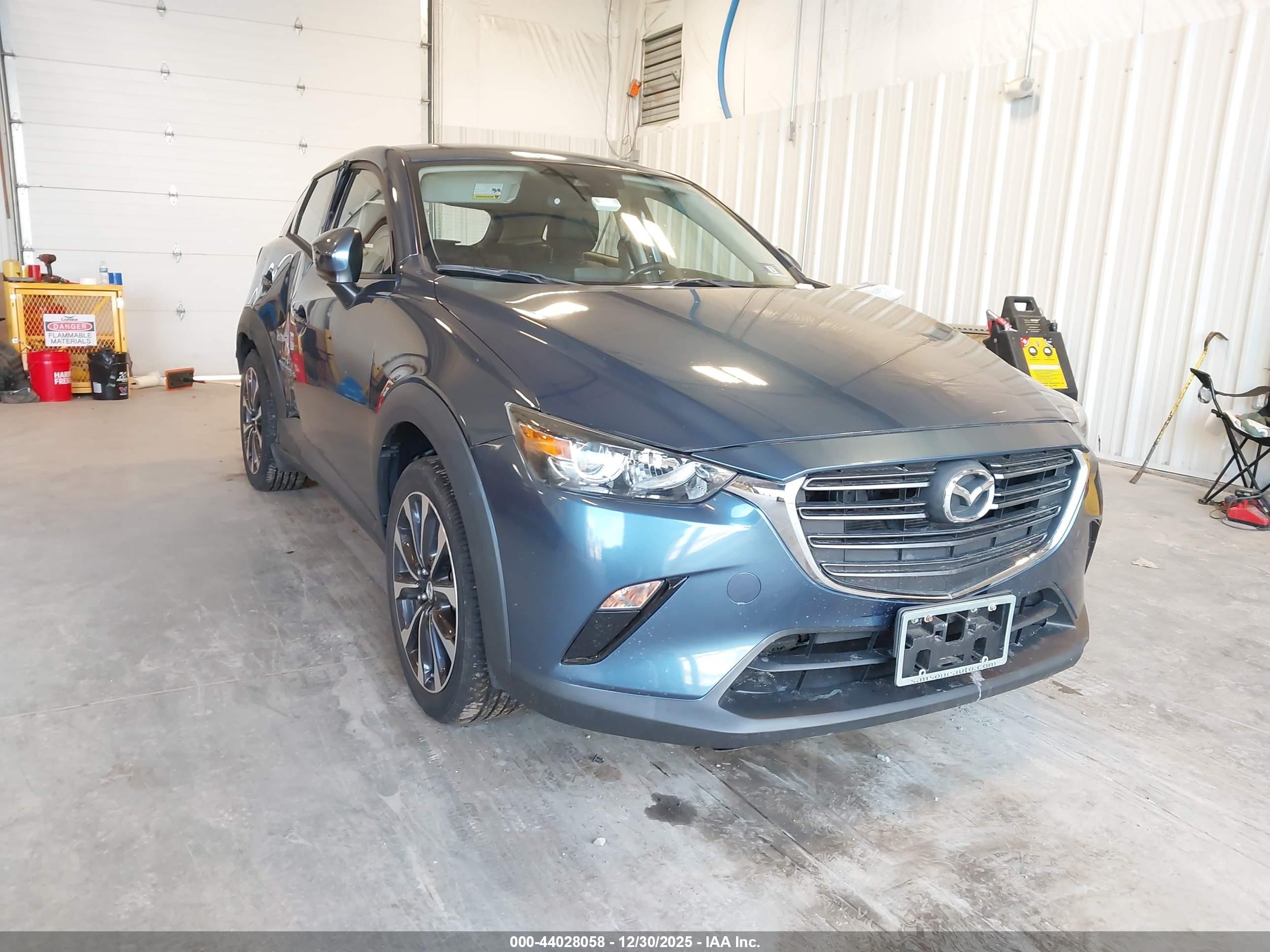 2019 Mazda CX-3 Touring, VIN JM1DKFC70K0423672 — Side
