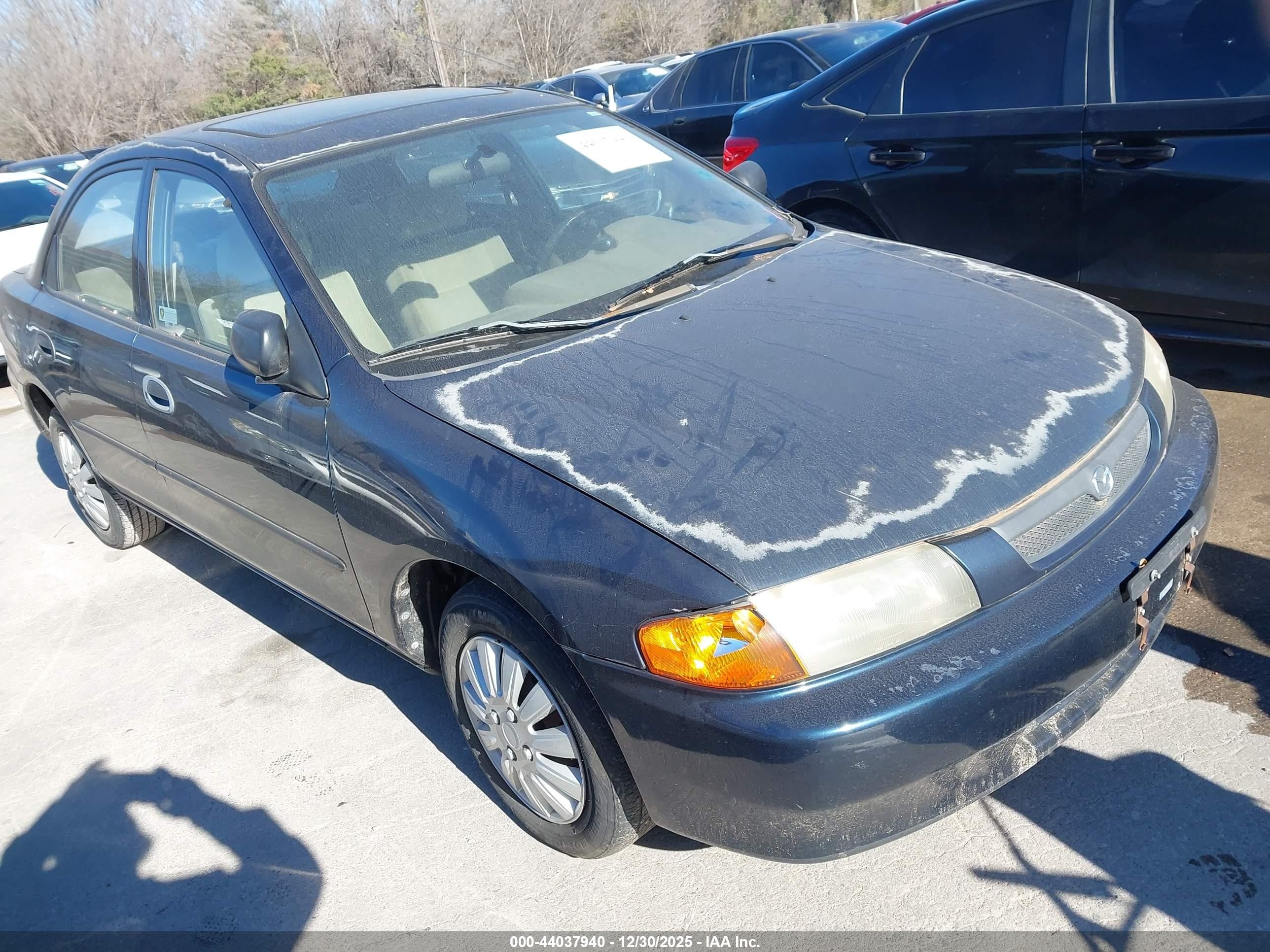 1998 Mazda Protege DX, VIN JM1BC1415W0221417 — Normal wear