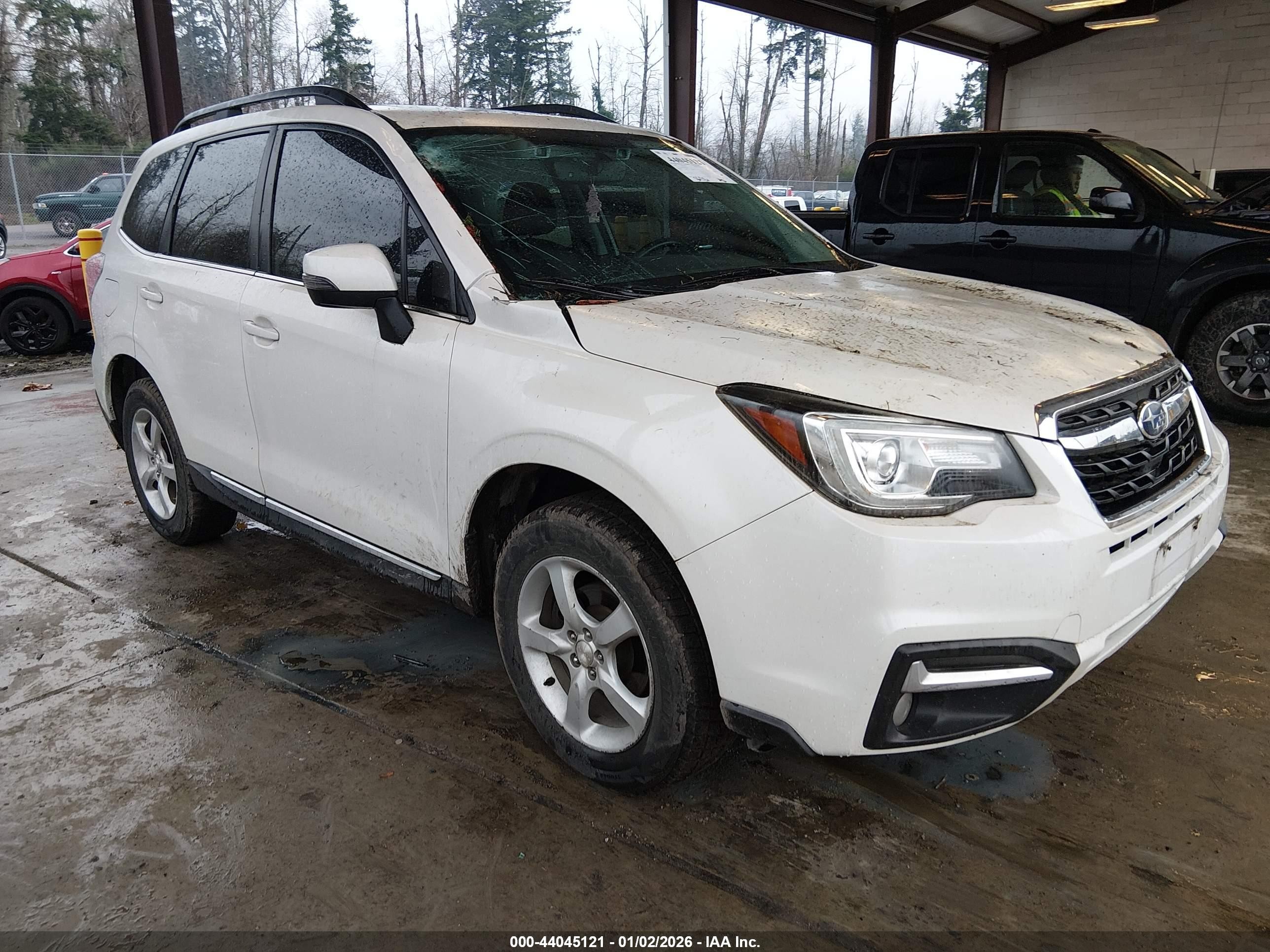 2018 Subaru Forester Touring, VIN JF2SJAWC0JH478811 — Storm