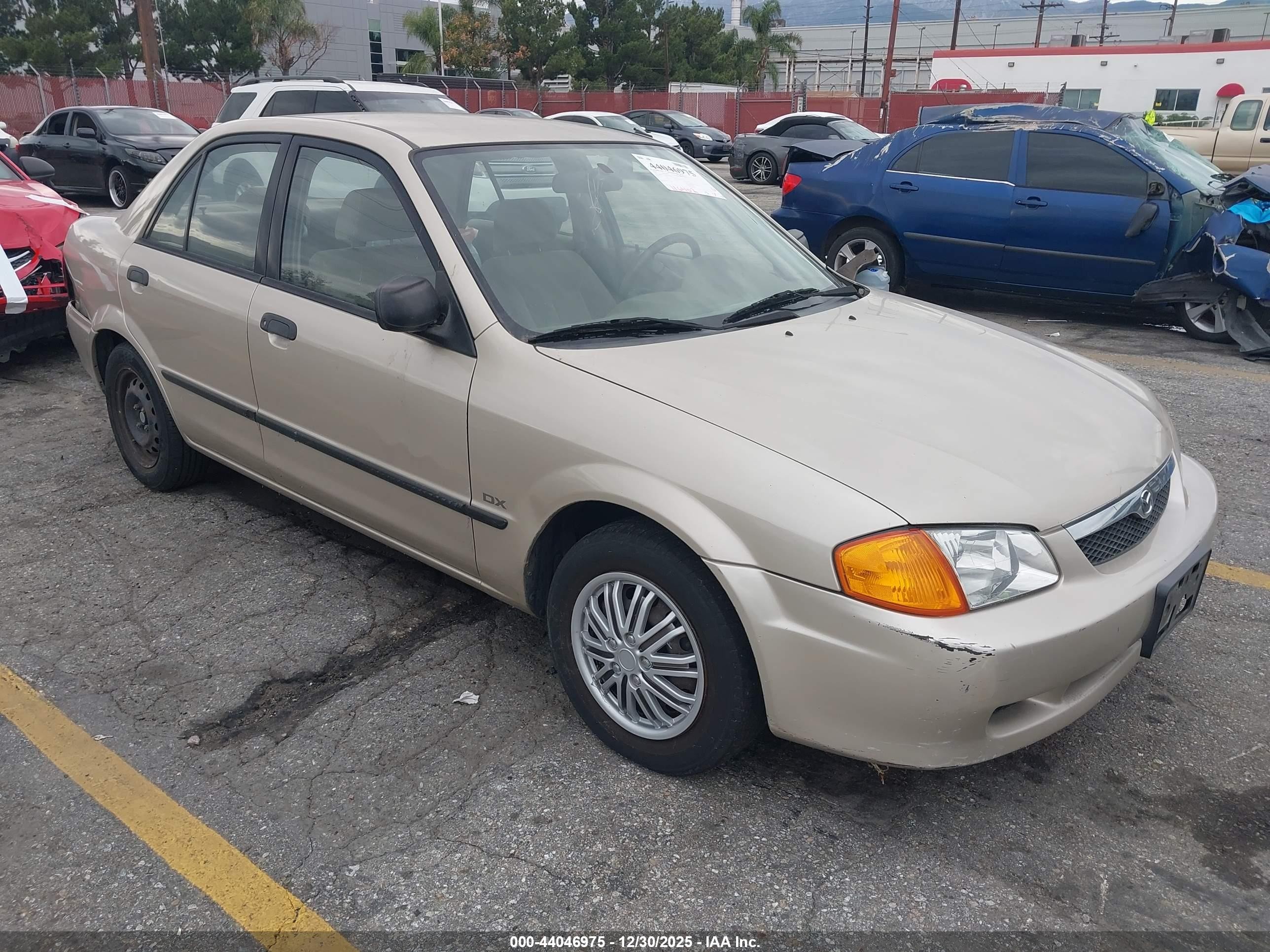 1999 Mazda Protege DX, VIN JM1BJ2223X0185624 — Бок